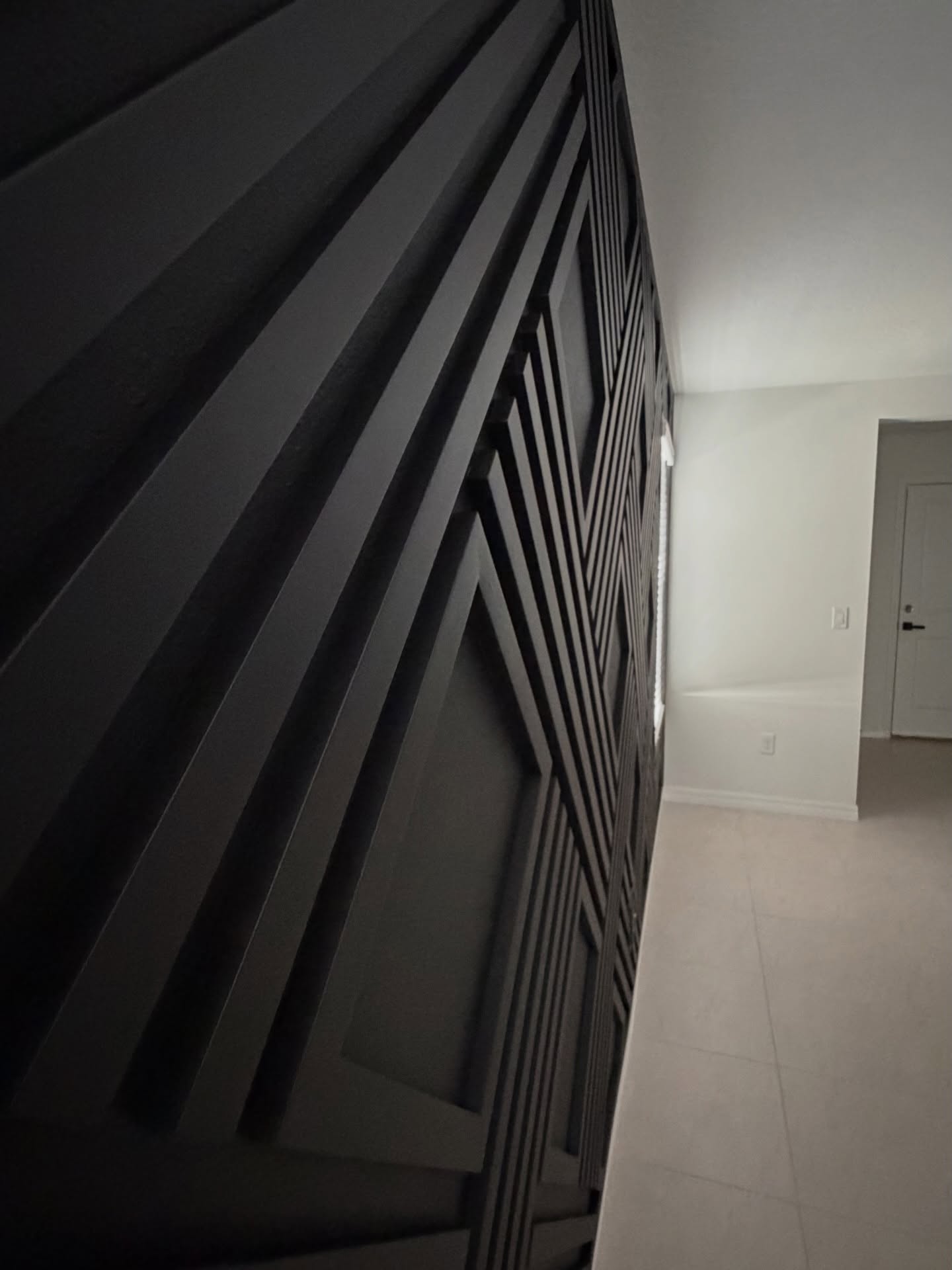 Wainscoting feature wall with chair rail by AVP Construction JAX — Jacksonville & St. John's County, FL