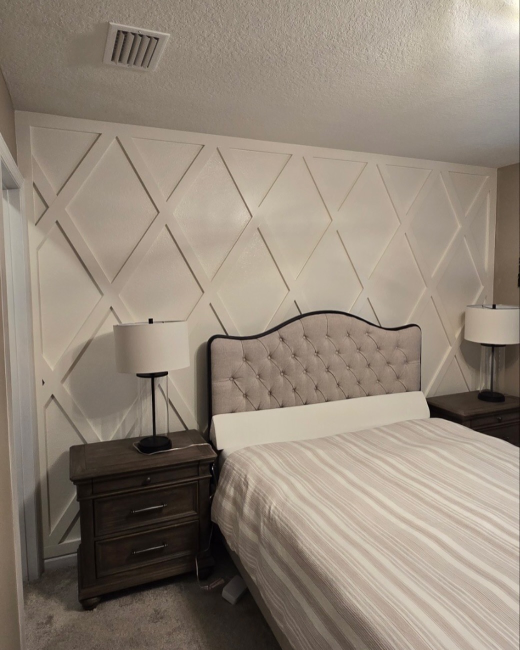 Floor-to-ceiling slat accent wall by AVP Construction JAX — Jacksonville & St. John's County, FL