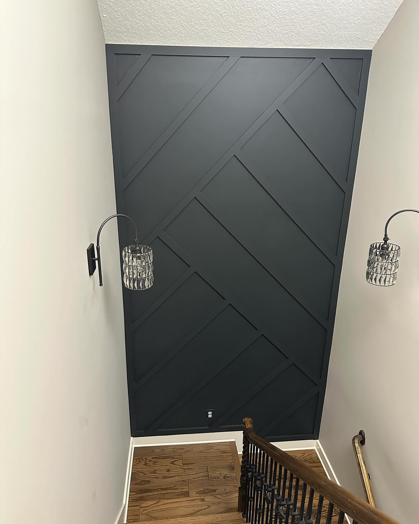 Floor-to-ceiling slat accent wall by AVP Construction JAX — Jacksonville & St. John's County, FL