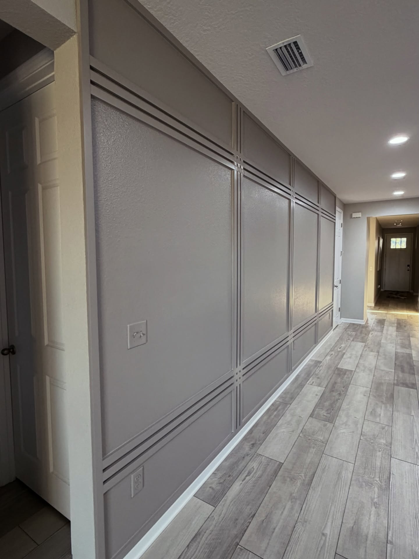 Vertical slat wood accent wall by AVP Construction JAX — Jacksonville & St. John's County, FL
