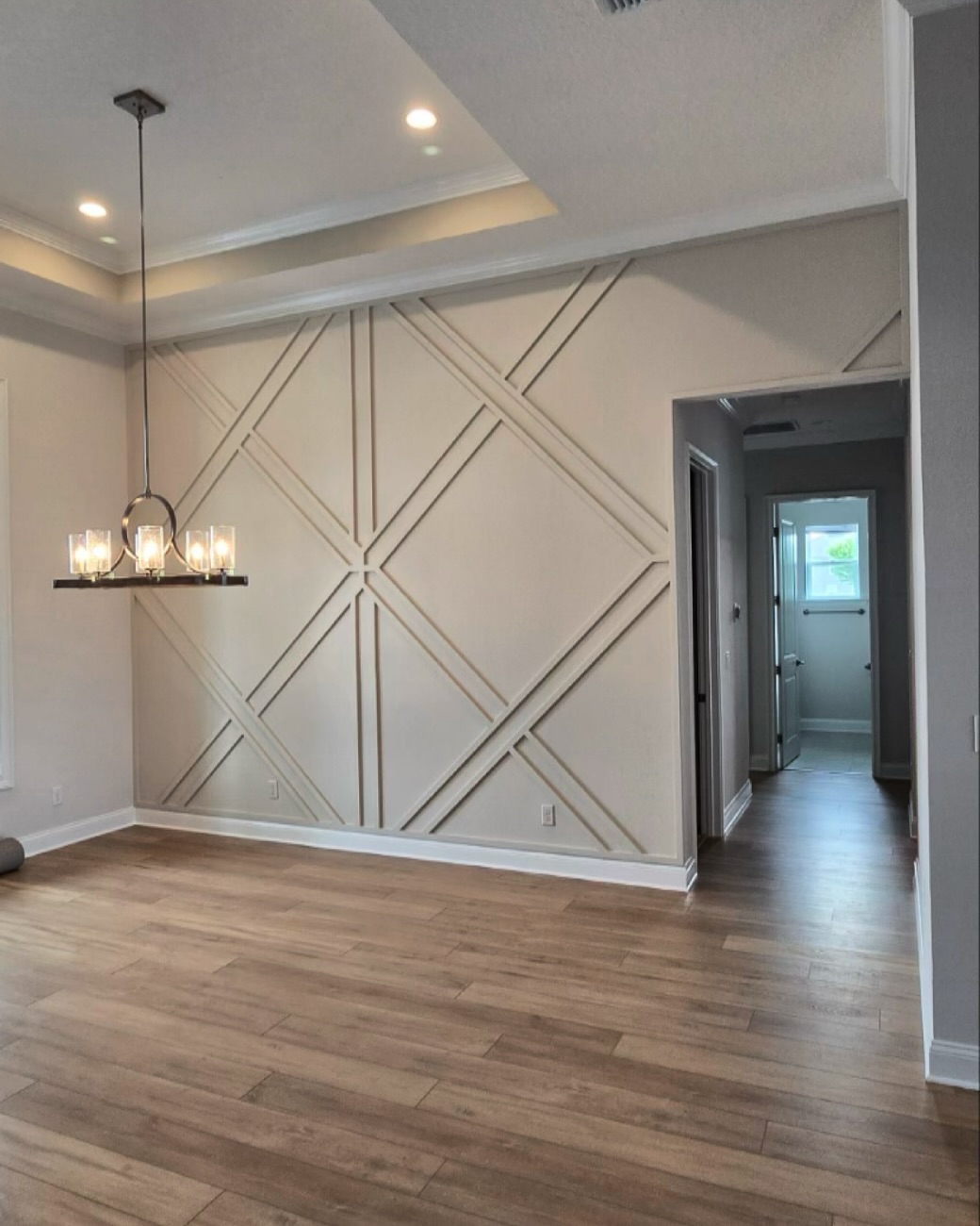 Floor-to-ceiling slat accent wall by AVP Construction JAX — Jacksonville & St. John's County, FL