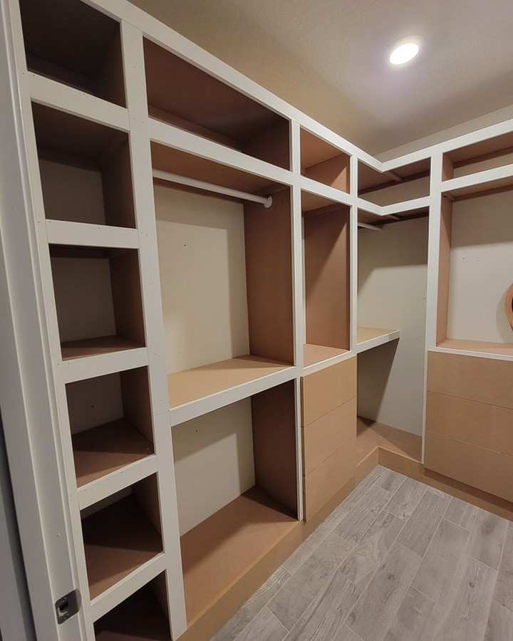 His-and-hers walk-in closet build-out by AVP Construction JAX — Jacksonville & St. John's County, FL