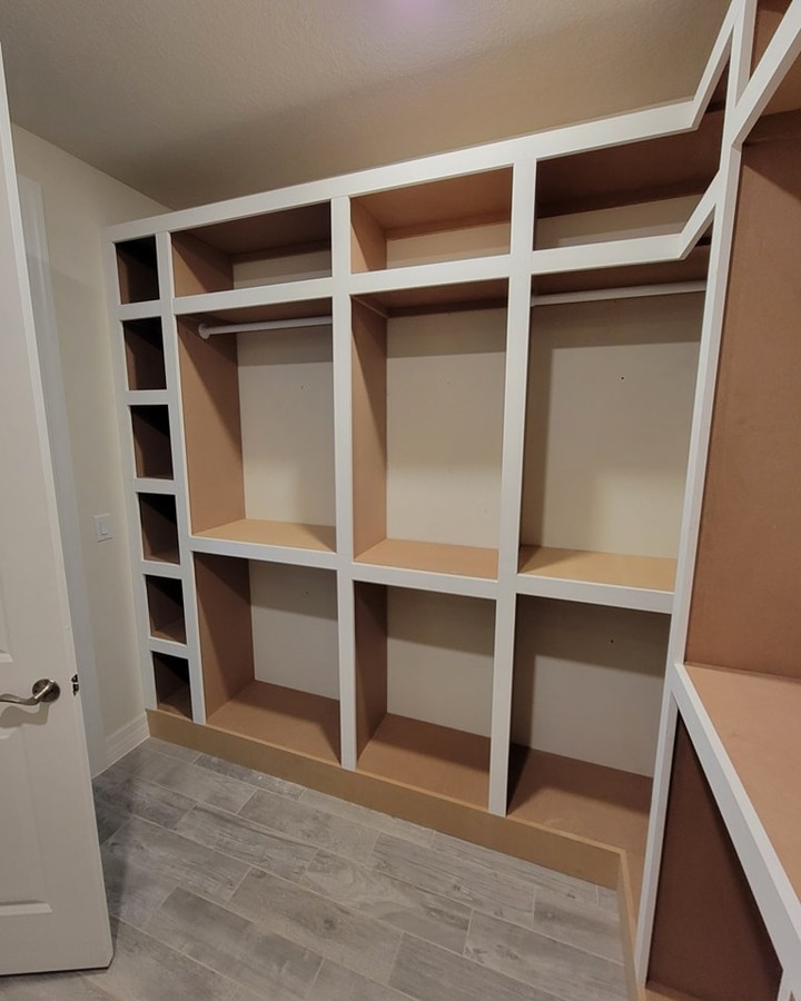 Custom shoe shelving in master closet by AVP Construction JAX — Jacksonville & St. John's County, FL