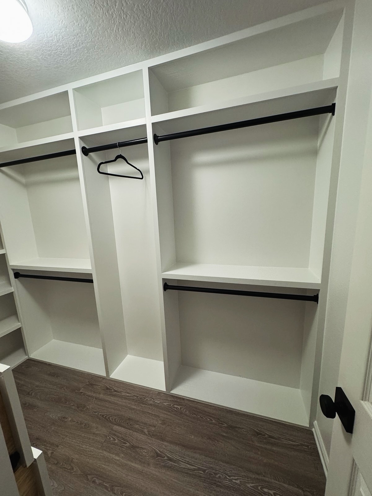 Wardrobe-style custom closet by AVP Construction JAX — Jacksonville & St. John's County, FL