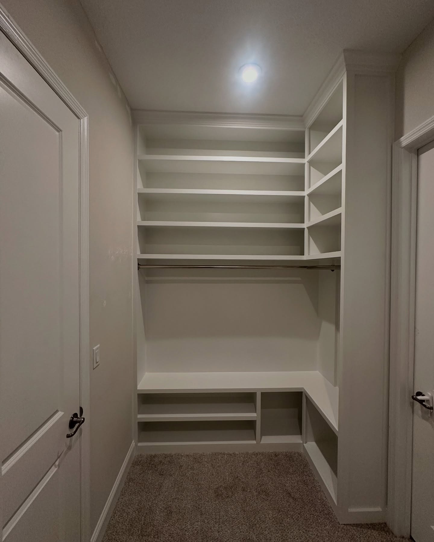 Custom shoe shelving in master closet by AVP Construction JAX — Jacksonville & St. John's County, FL