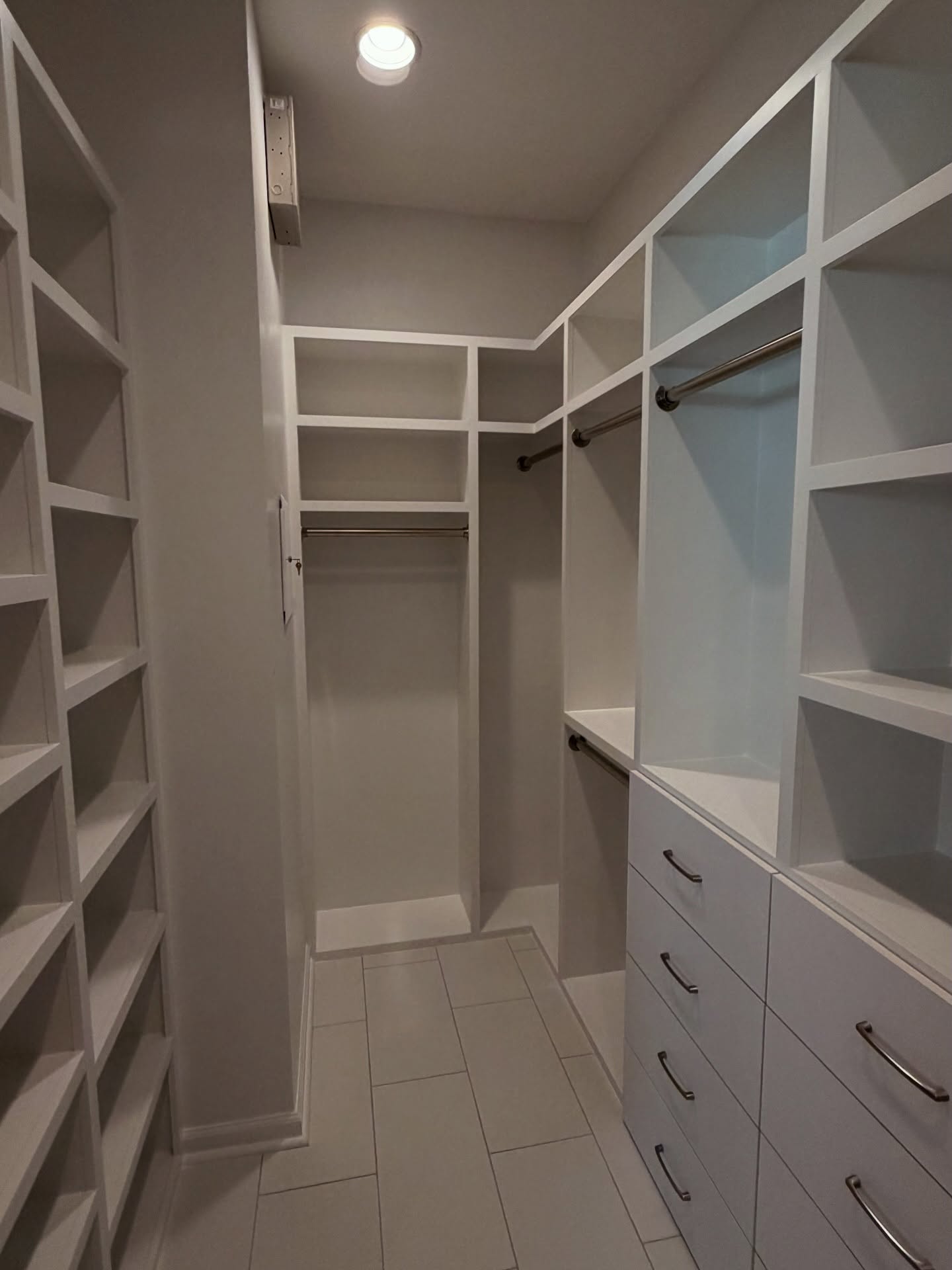 Master closet with island storage by AVP Construction JAX — Jacksonville & St. John's County, FL