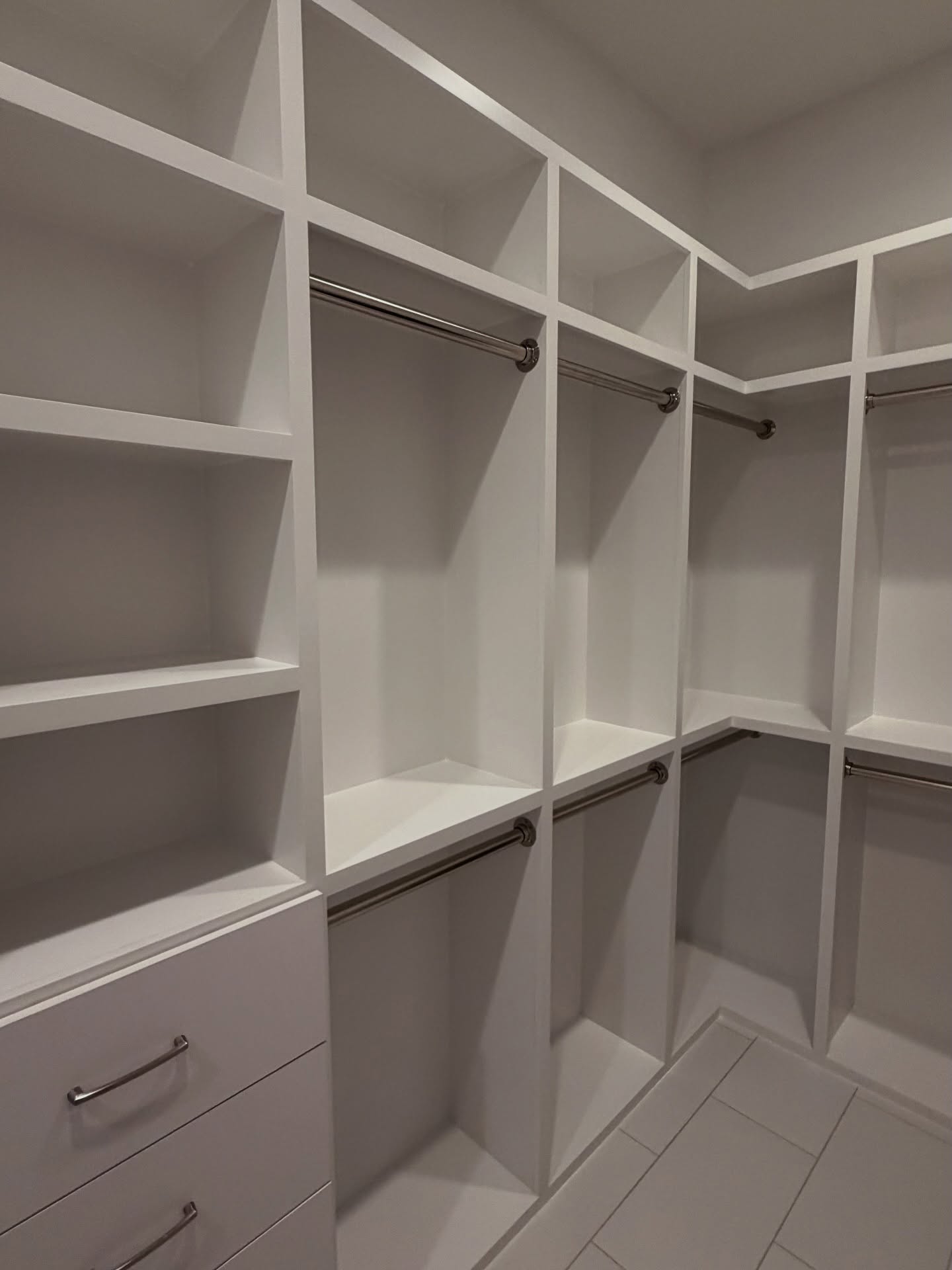 Custom closet system with drawers and hanging by AVP Construction JAX — Jacksonville & St. John's County, FL