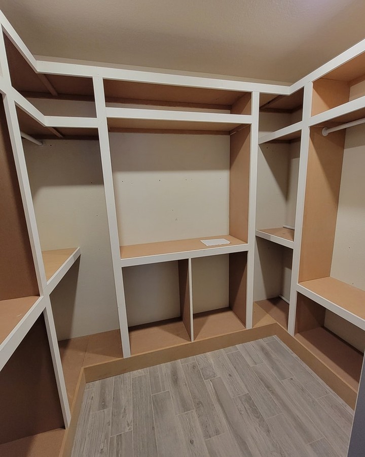 Custom shoe shelving in master closet by AVP Construction JAX — Jacksonville & St. John's County, FL