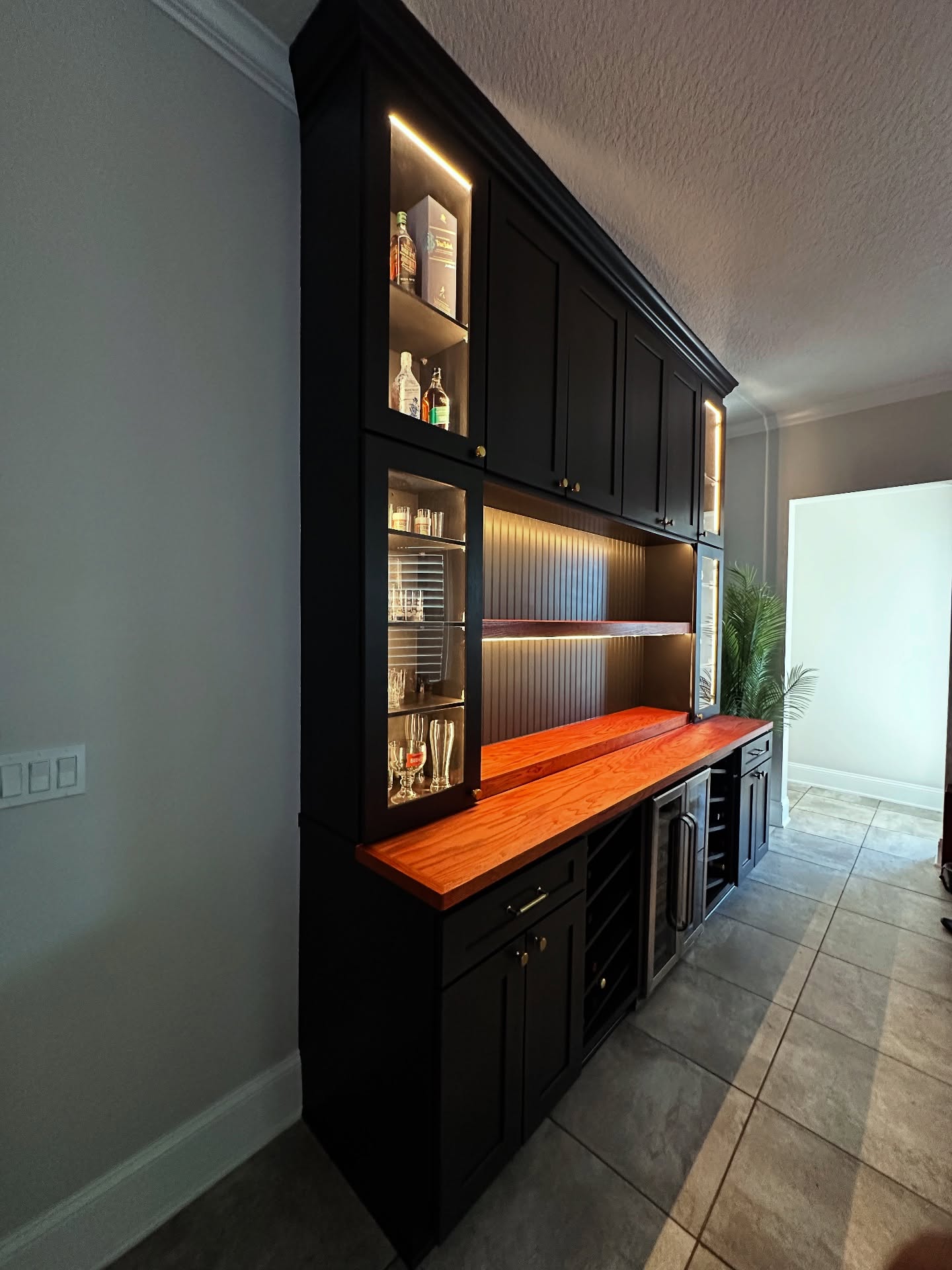 Floor-to-ceiling dry bar millwork by AVP Construction JAX — Jacksonville & St. John's County, FL