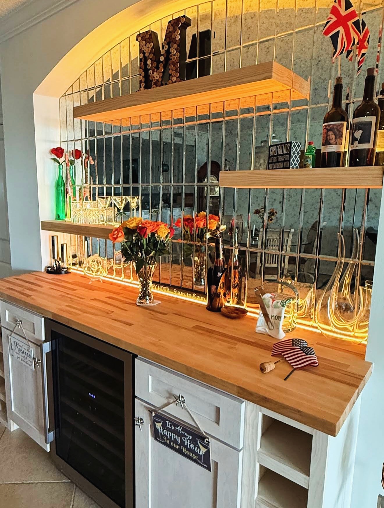 Compact dry bar tucked into a feature wall by AVP Construction JAX — Jacksonville & St. John's County, FL