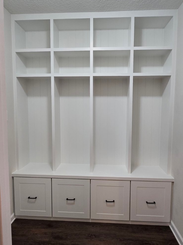 Built-in laundry room with folding counter by AVP Construction JAX — Jacksonville & St. John's County, FL