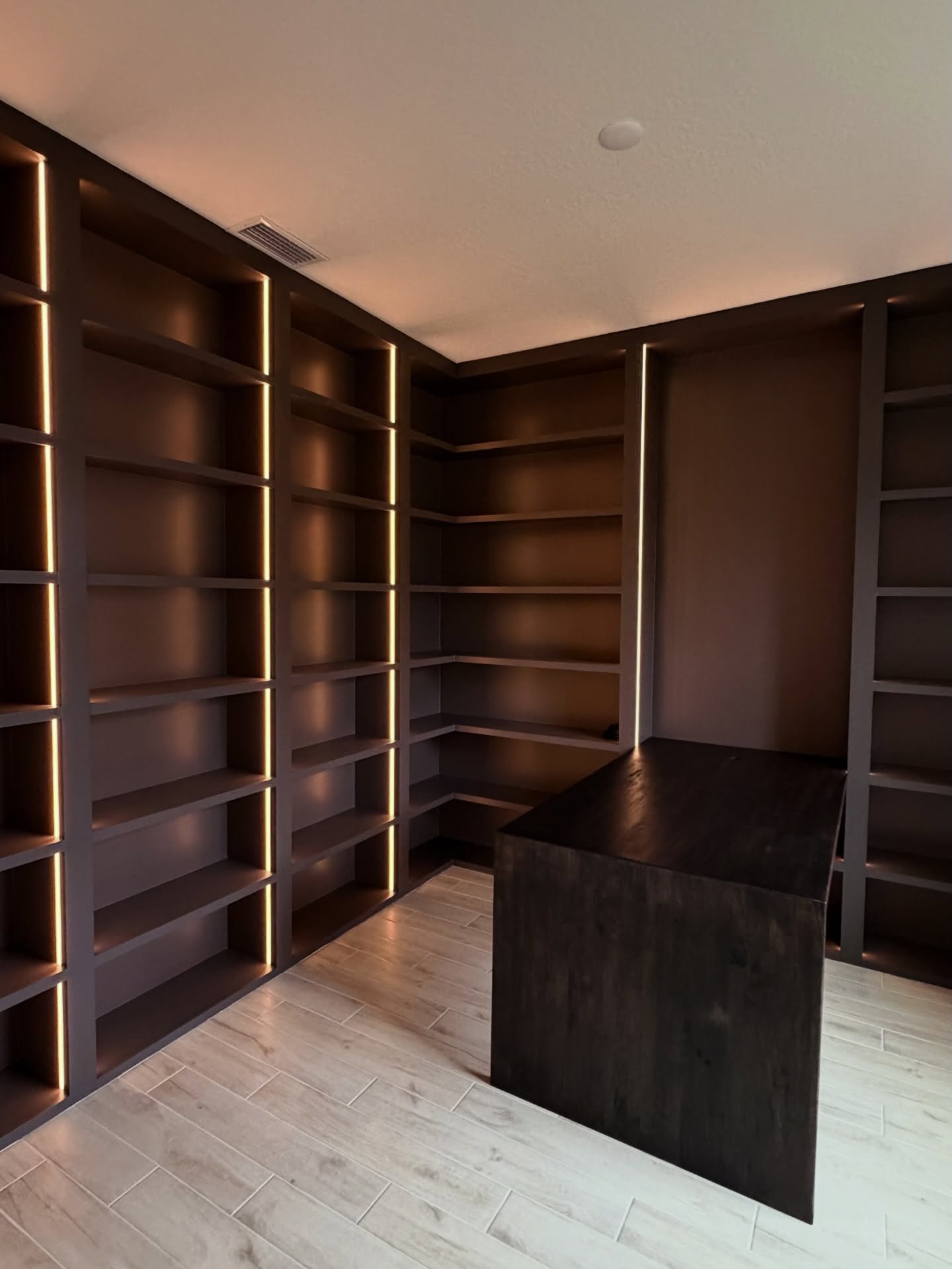 Home office wall of shelves and drawers by AVP Construction JAX — Jacksonville & St. John's County, FL