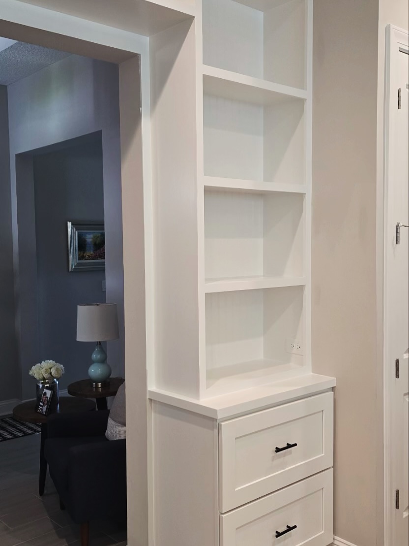Home office wall of shelves and drawers by AVP Construction JAX — Jacksonville & St. John's County, FL
