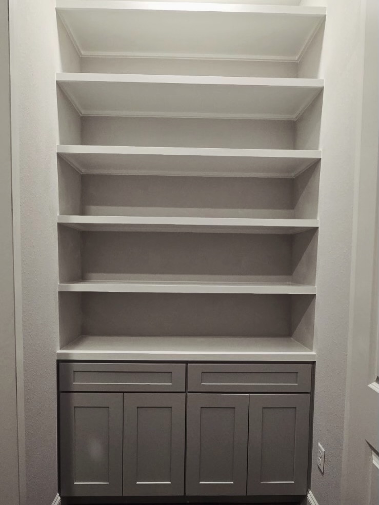 Home office wall of shelves and drawers by AVP Construction JAX — Jacksonville & St. John's County, FL