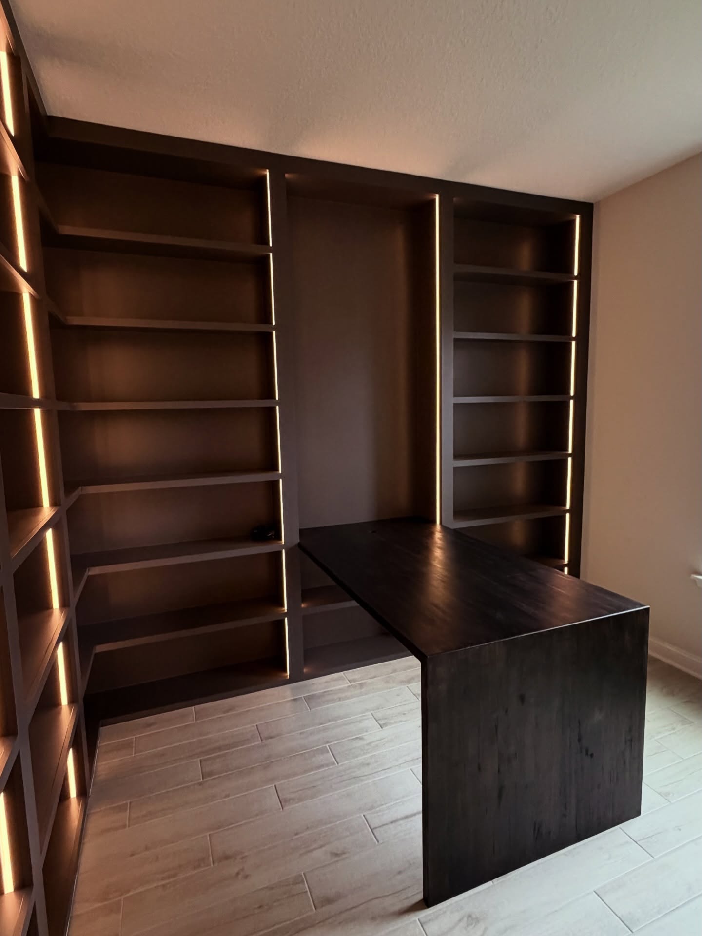 Custom desk and overhead cabinet built-in by AVP Construction JAX — Jacksonville & St. John's County, FL