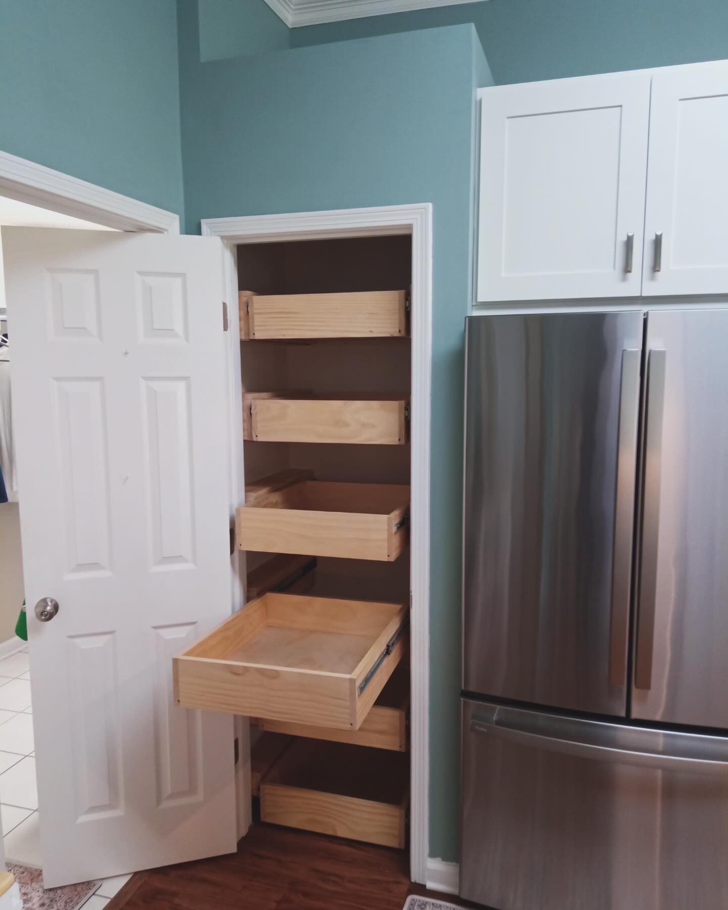Custom pantry door and interior shelving by AVP Construction JAX — Jacksonville & St. John's County, FL