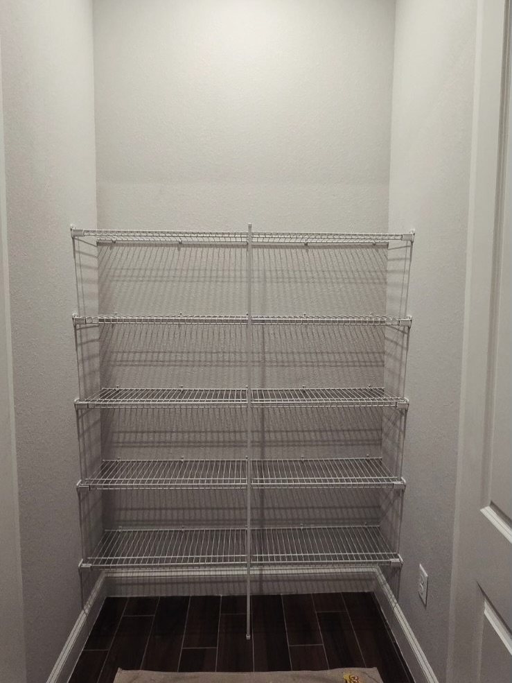 Modern pantry millwork with pull-out drawers by AVP Construction JAX — Jacksonville & St. John's County, FL