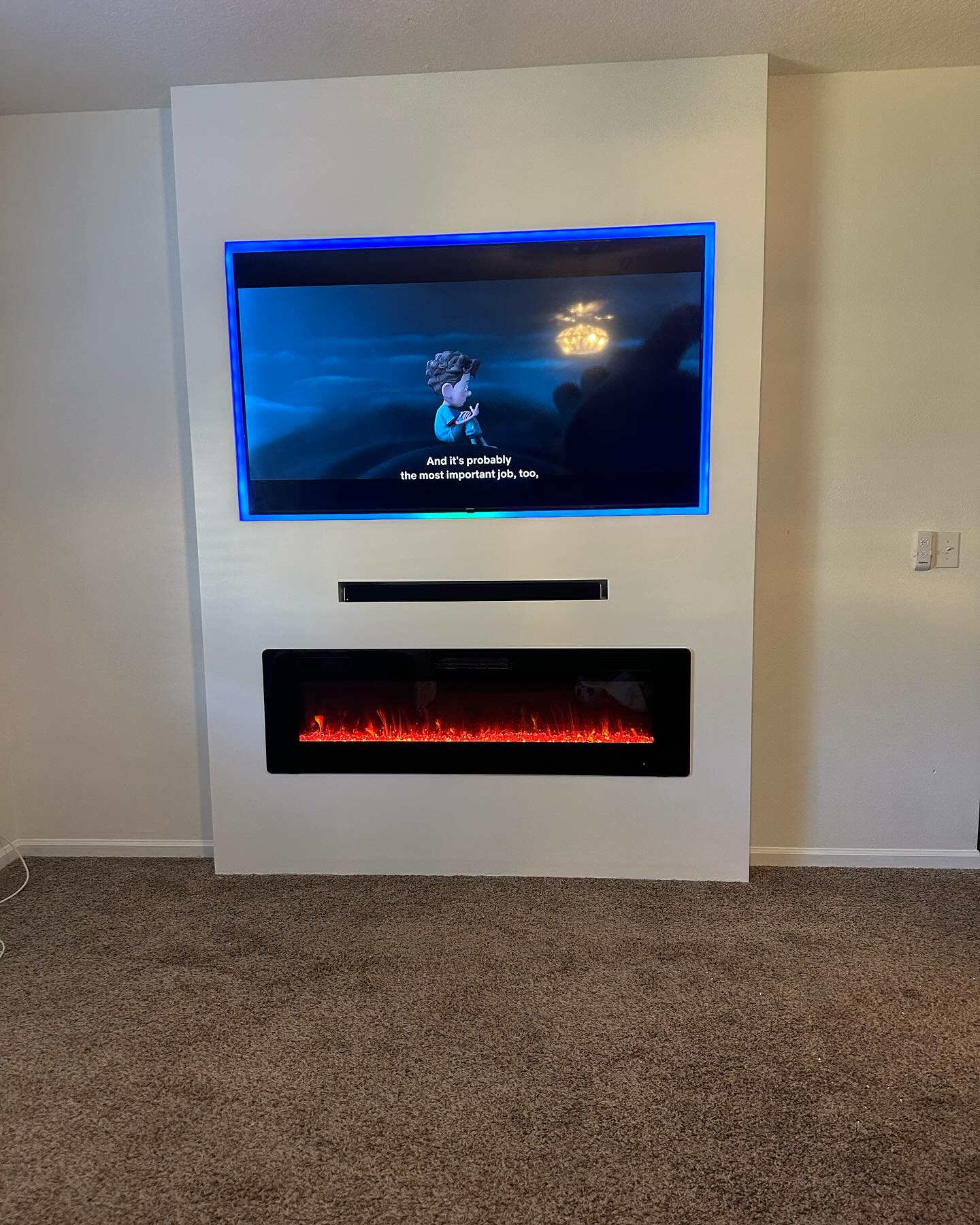 Floor-to-ceiling media wall with custom millwork by AVP Construction JAX — Jacksonville & St. John's County, FL