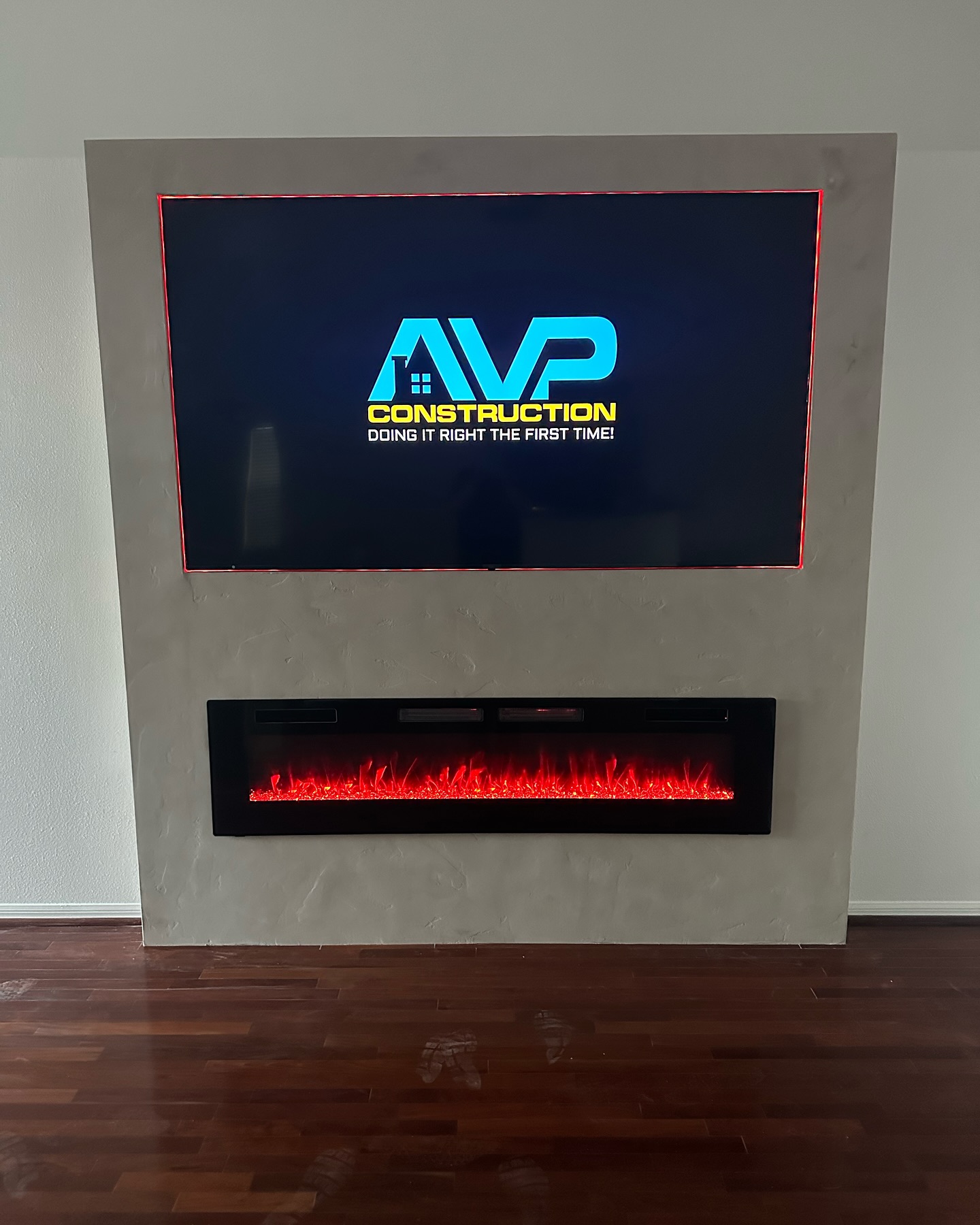 Floating-shelf TV built-in with shaker cabinets by AVP Construction JAX — Jacksonville & St. John's County, FL