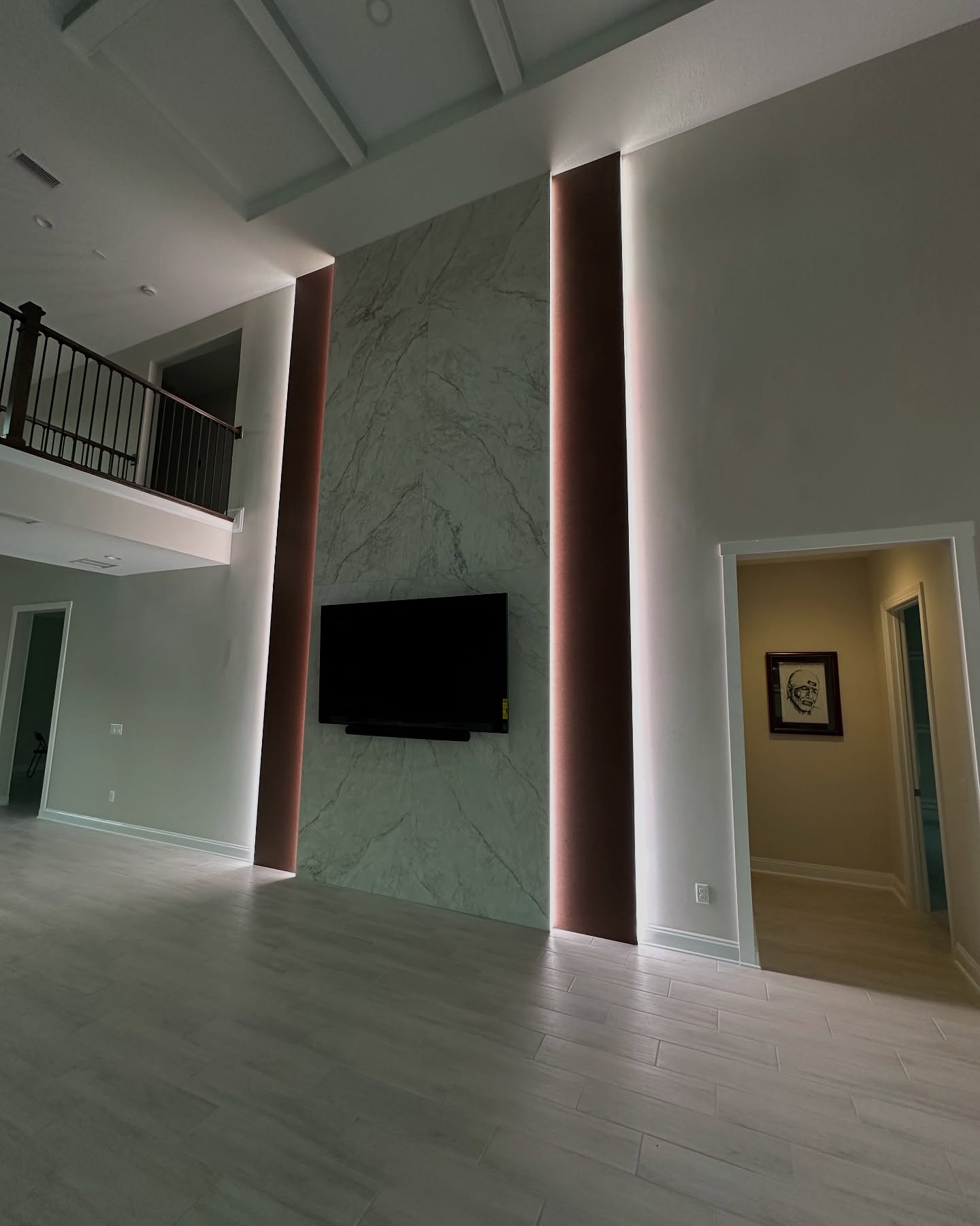 Wall-mounted TV with under-cabinet storage by AVP Construction JAX — Jacksonville & St. John's County, FL