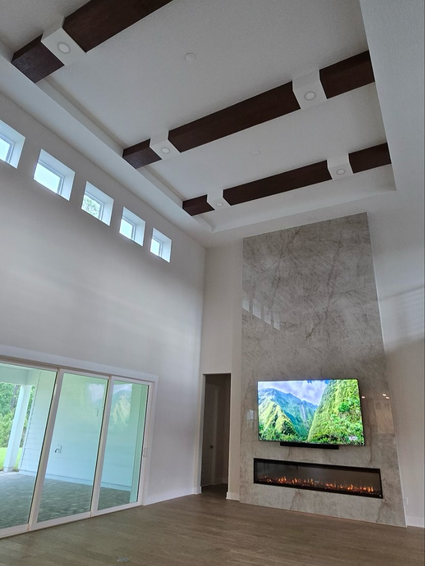 Modern entertainment center with electric fireplace by AVP Construction JAX — Jacksonville & St. John's County, FL