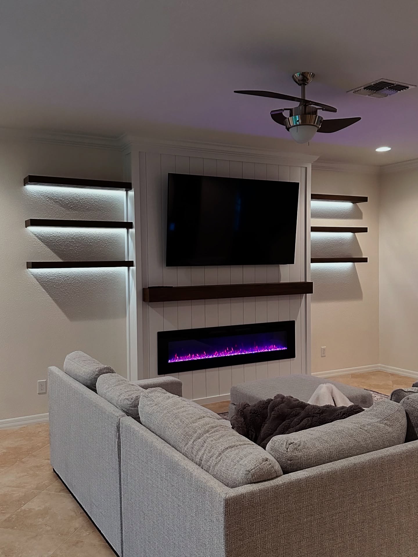 Built-in TV cabinet flanked by display shelving by AVP Construction JAX — Jacksonville & St. John's County, FL