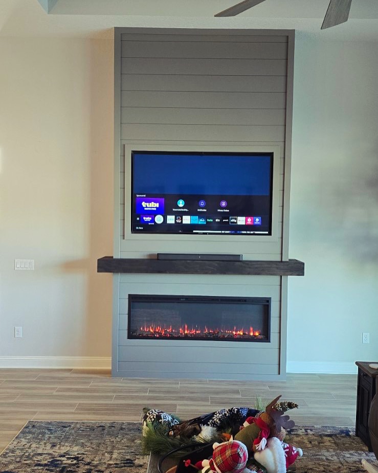 Custom living-room media wall with paneling by AVP Construction JAX — Jacksonville & St. John's County, FL