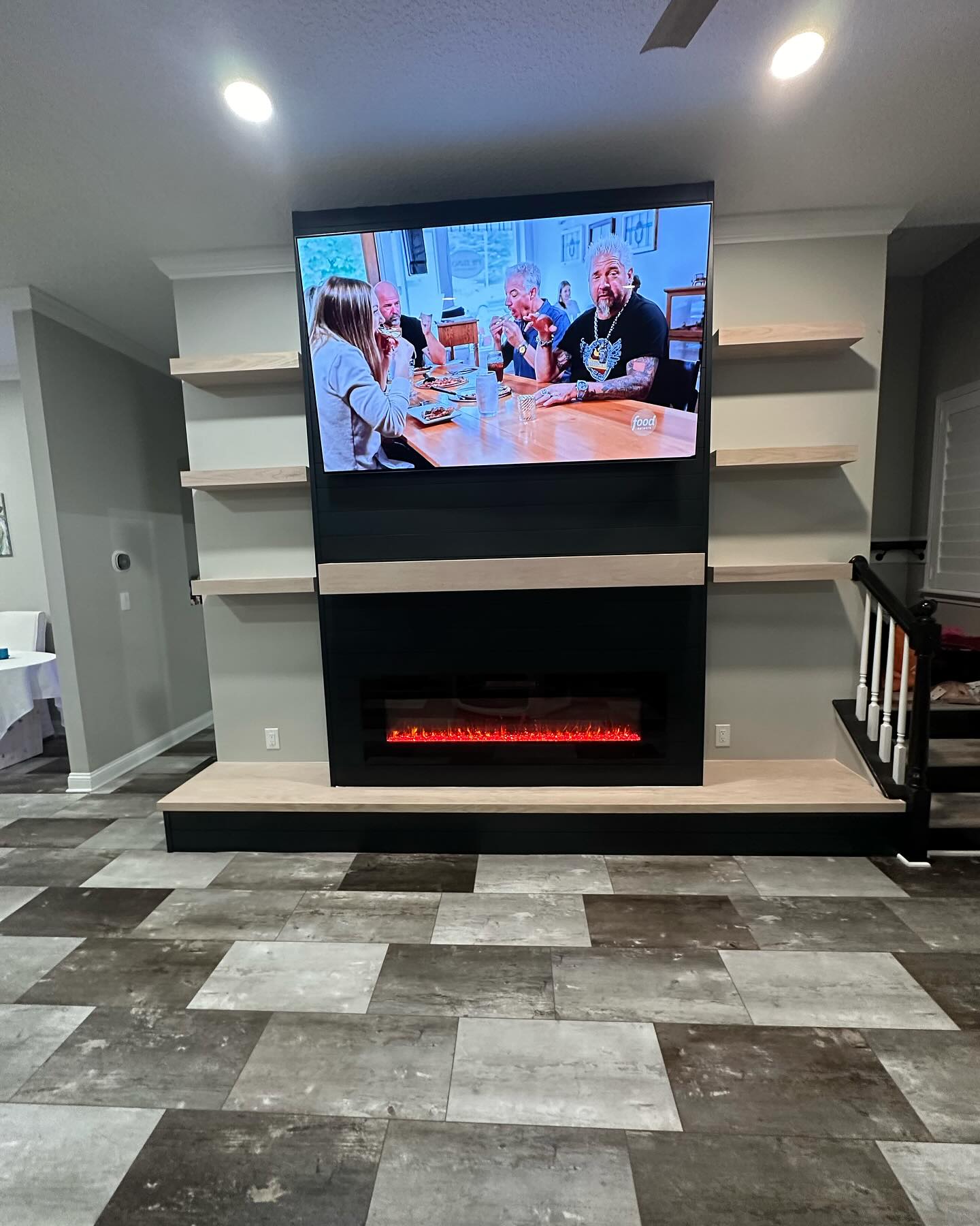 Floor-to-ceiling media wall with custom millwork by AVP Construction JAX — Jacksonville & St. John's County, FL