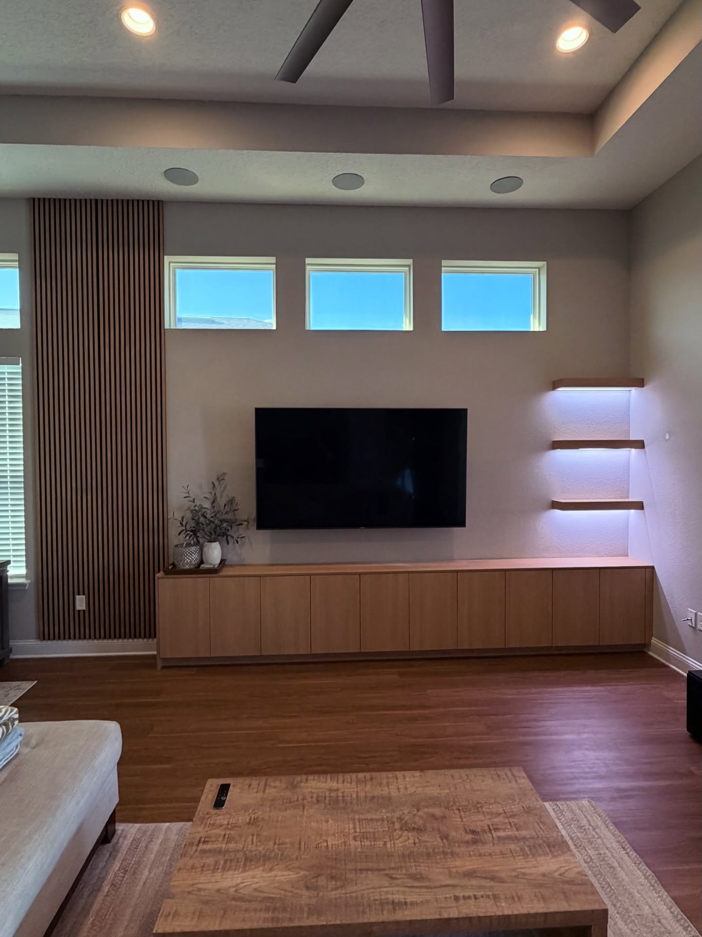 Modern entertainment center with electric fireplace by AVP Construction JAX — Jacksonville & St. John's County, FL