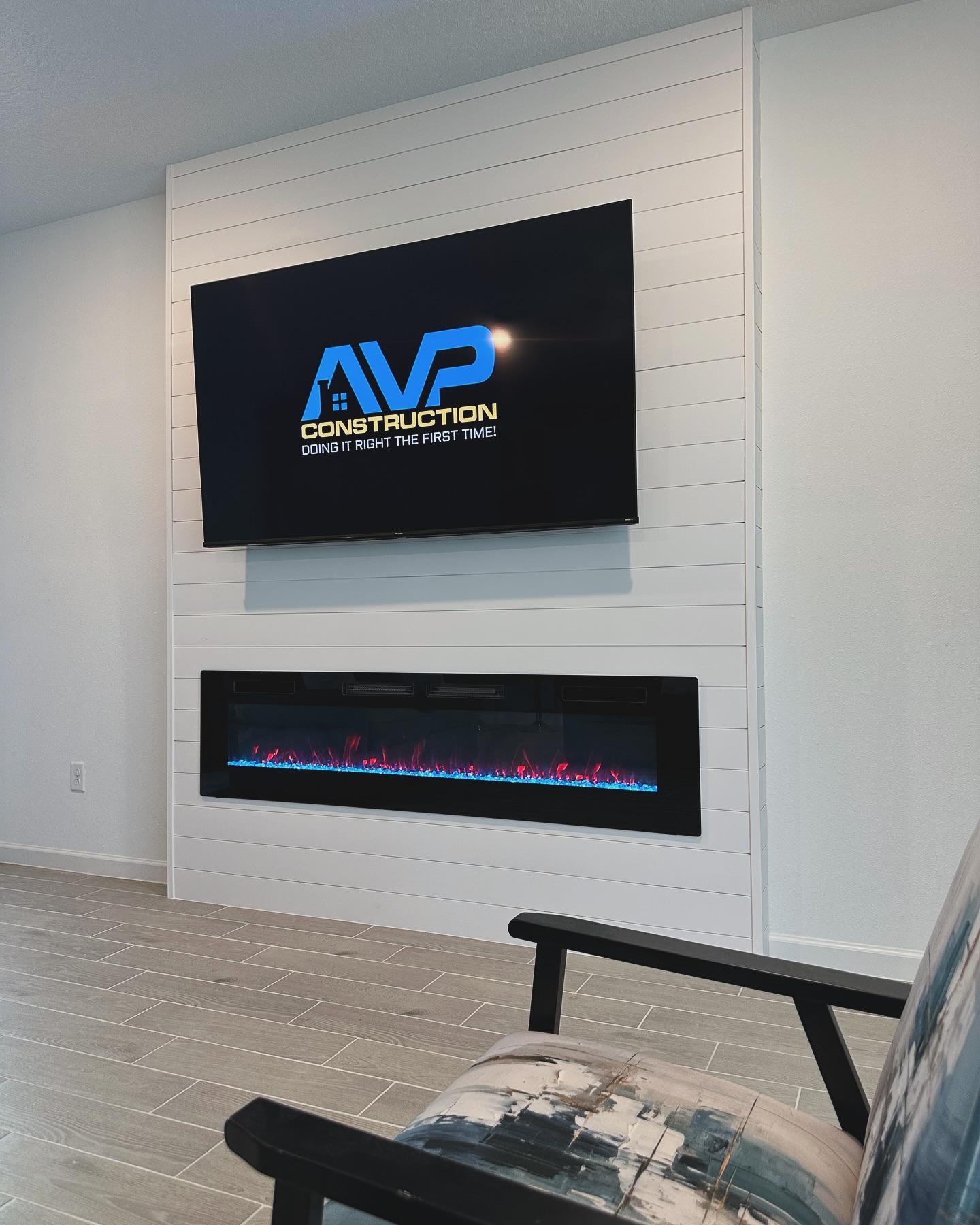 Custom living-room media wall with paneling by AVP Construction JAX — Jacksonville & St. John's County, FL