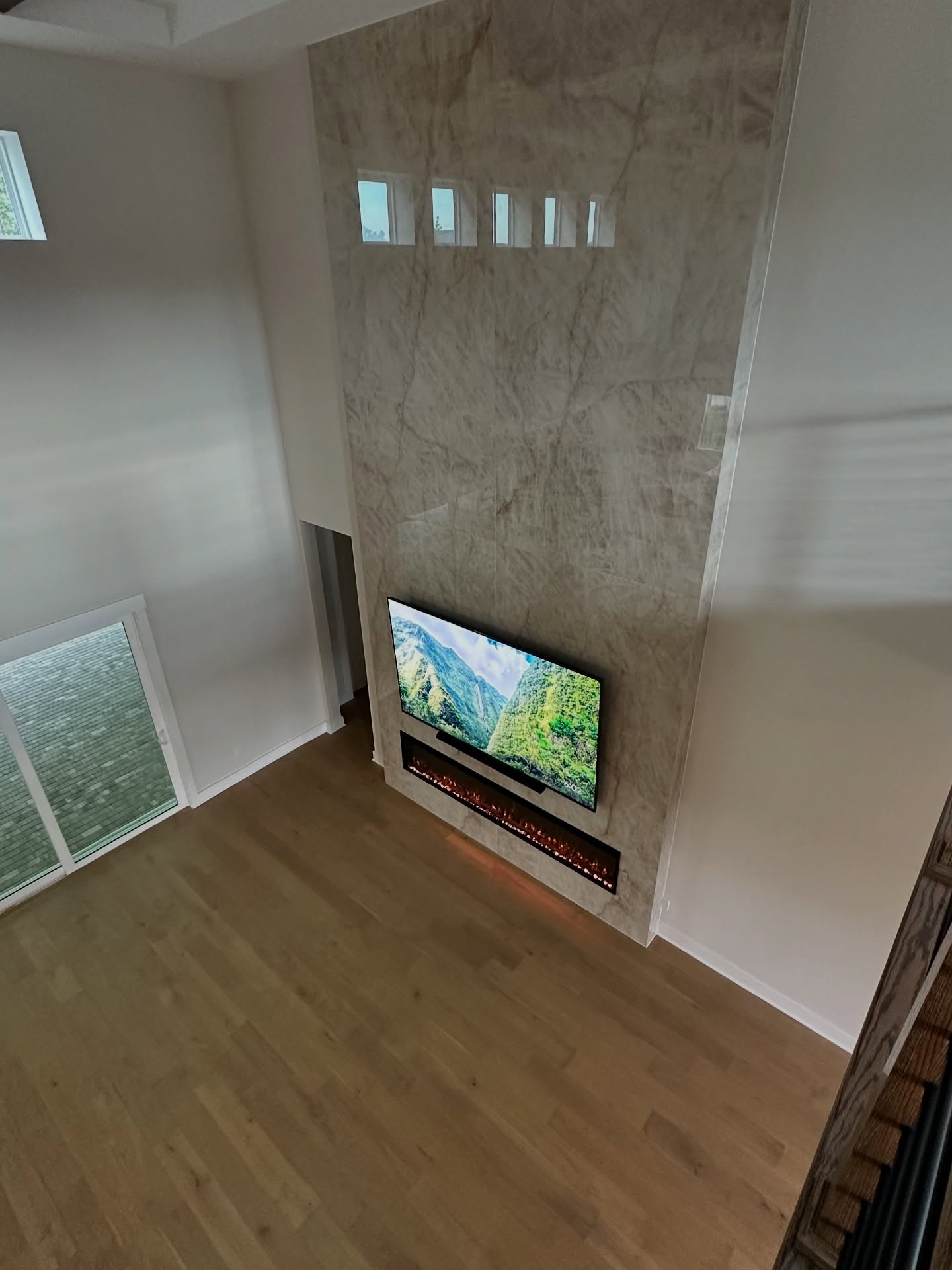 Slat-wall TV feature with hidden wiring by AVP Construction JAX — Jacksonville & St. John's County, FL