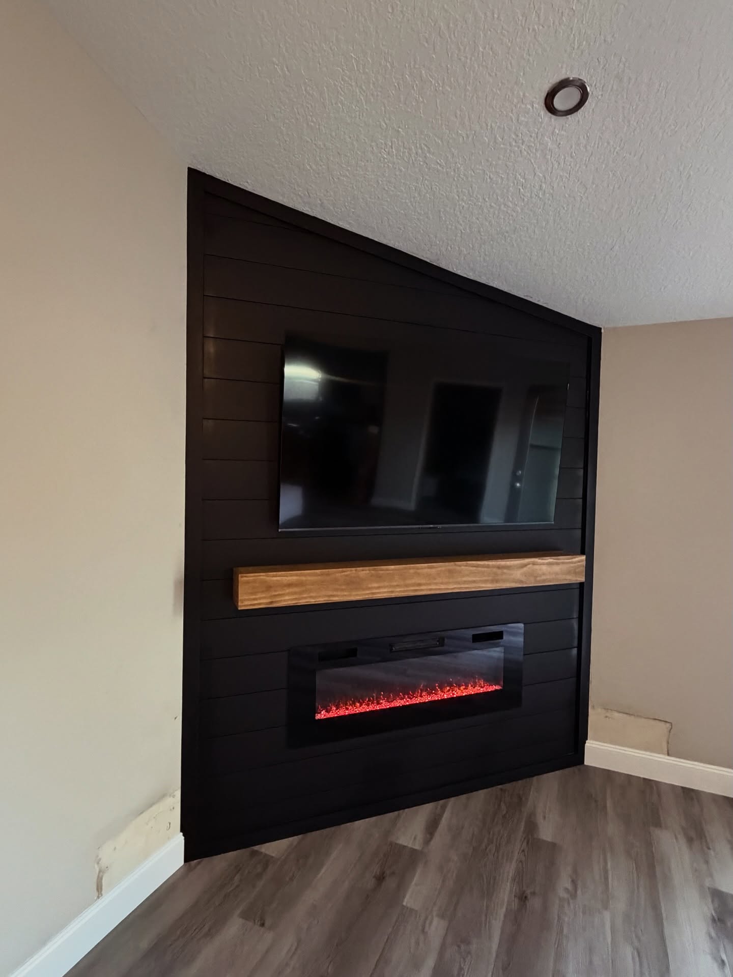 Floor-to-ceiling media wall with custom millwork by AVP Construction JAX — Jacksonville & St. John's County, FL