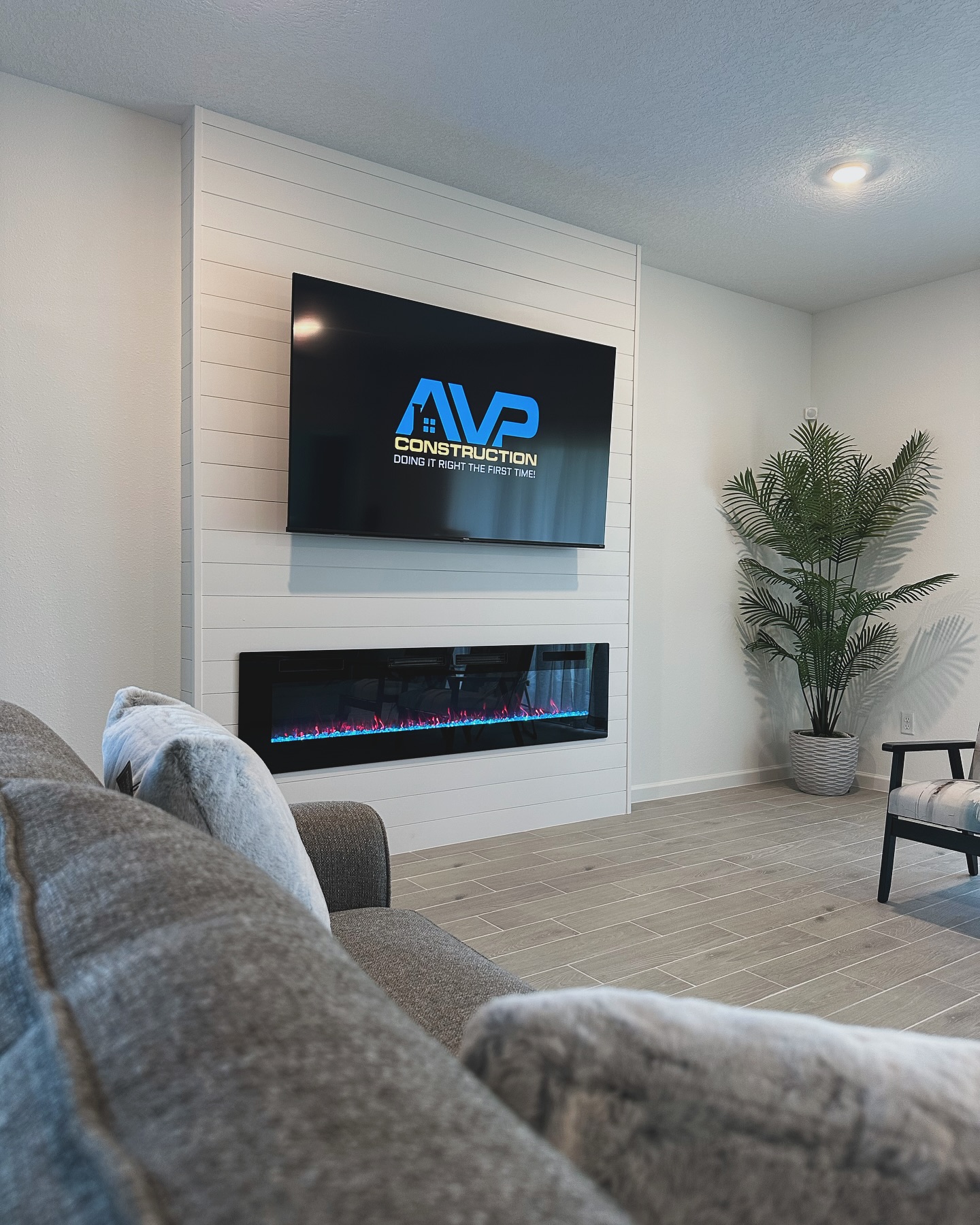 Floating-shelf TV built-in with shaker cabinets by AVP Construction JAX — Jacksonville & St. John's County, FL