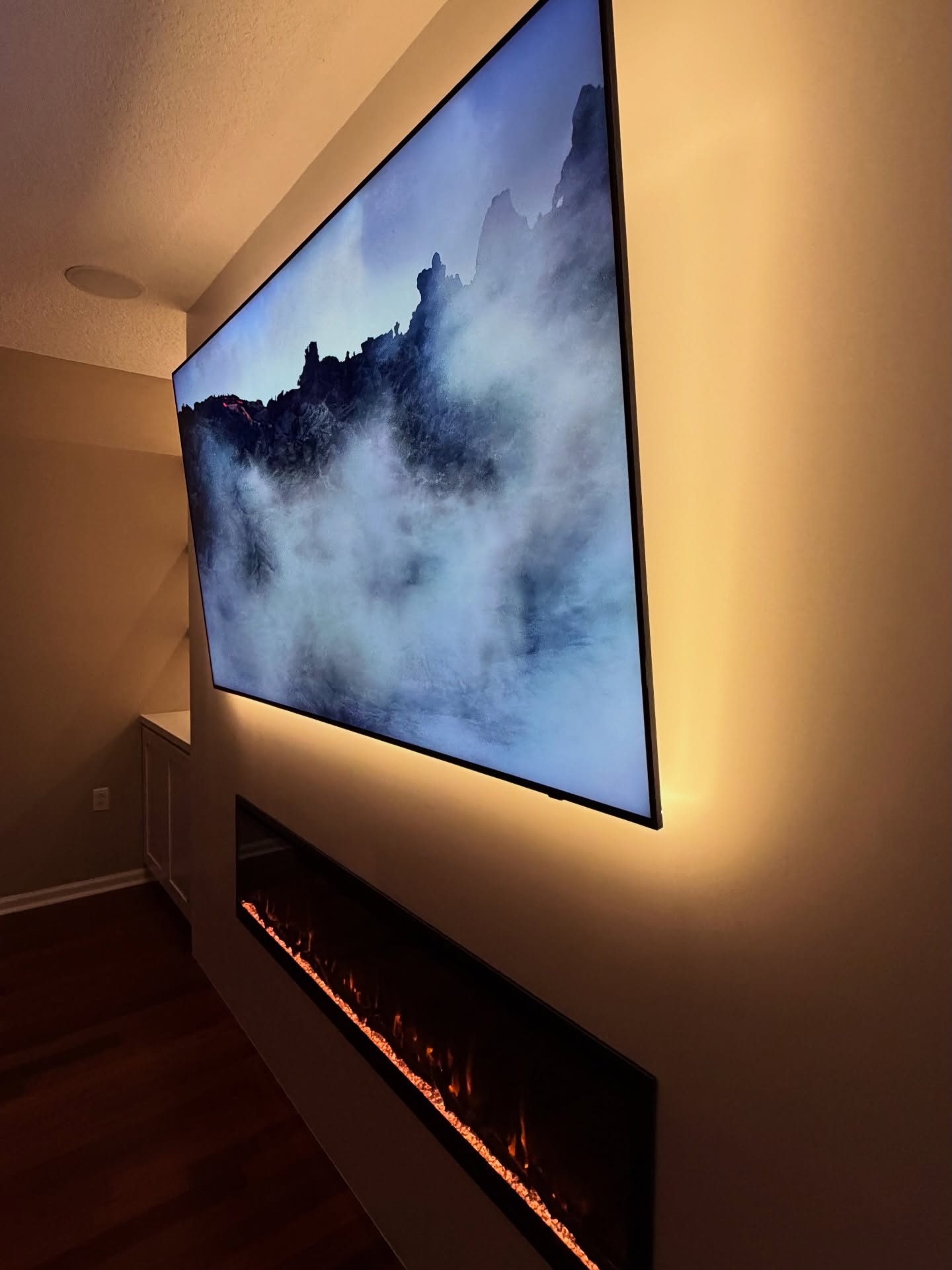 Wall-mounted TV with under-cabinet storage by AVP Construction JAX — Jacksonville & St. John's County, FL
