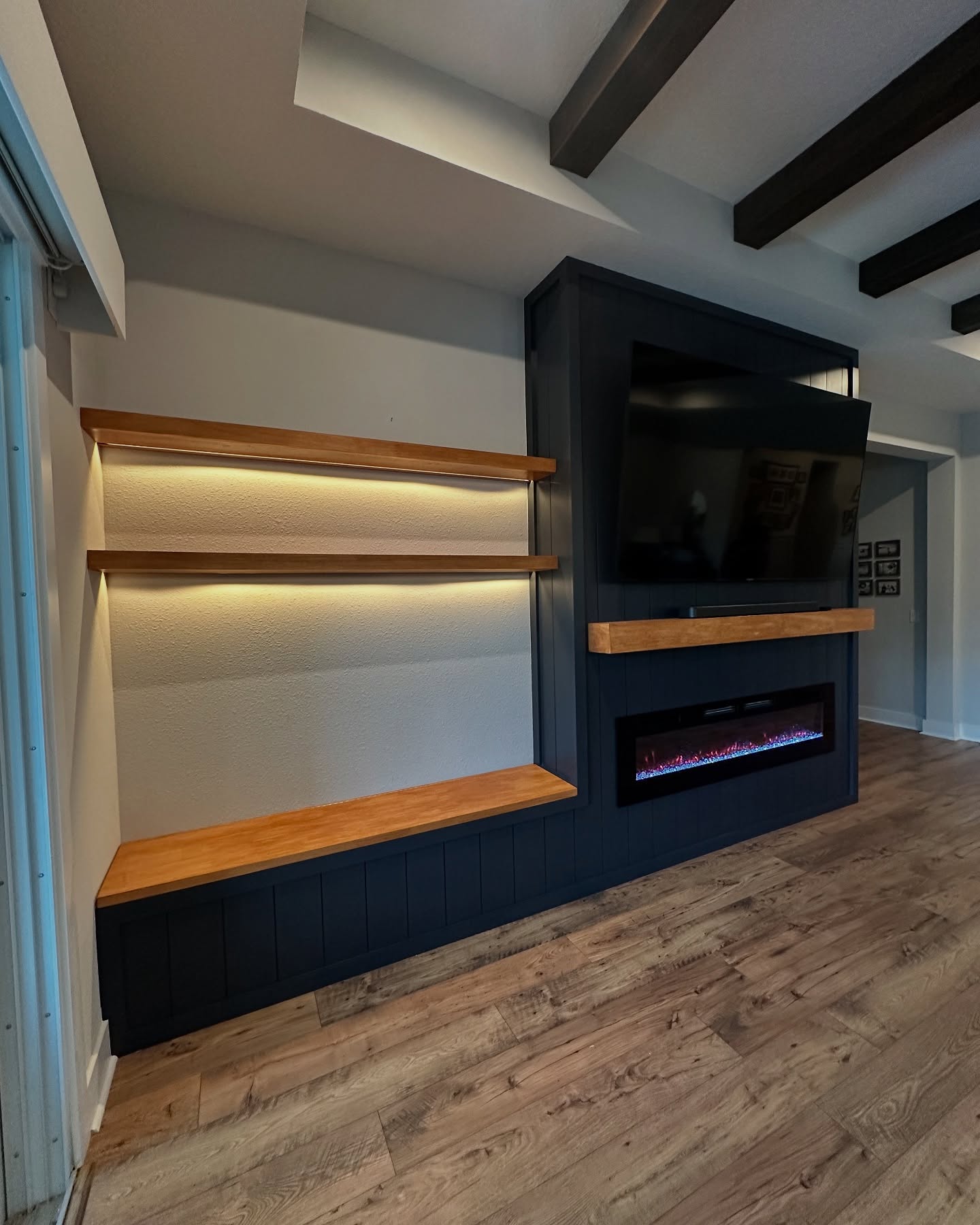 Built-in TV cabinet flanked by display shelving by AVP Construction JAX — Jacksonville & St. John's County, FL