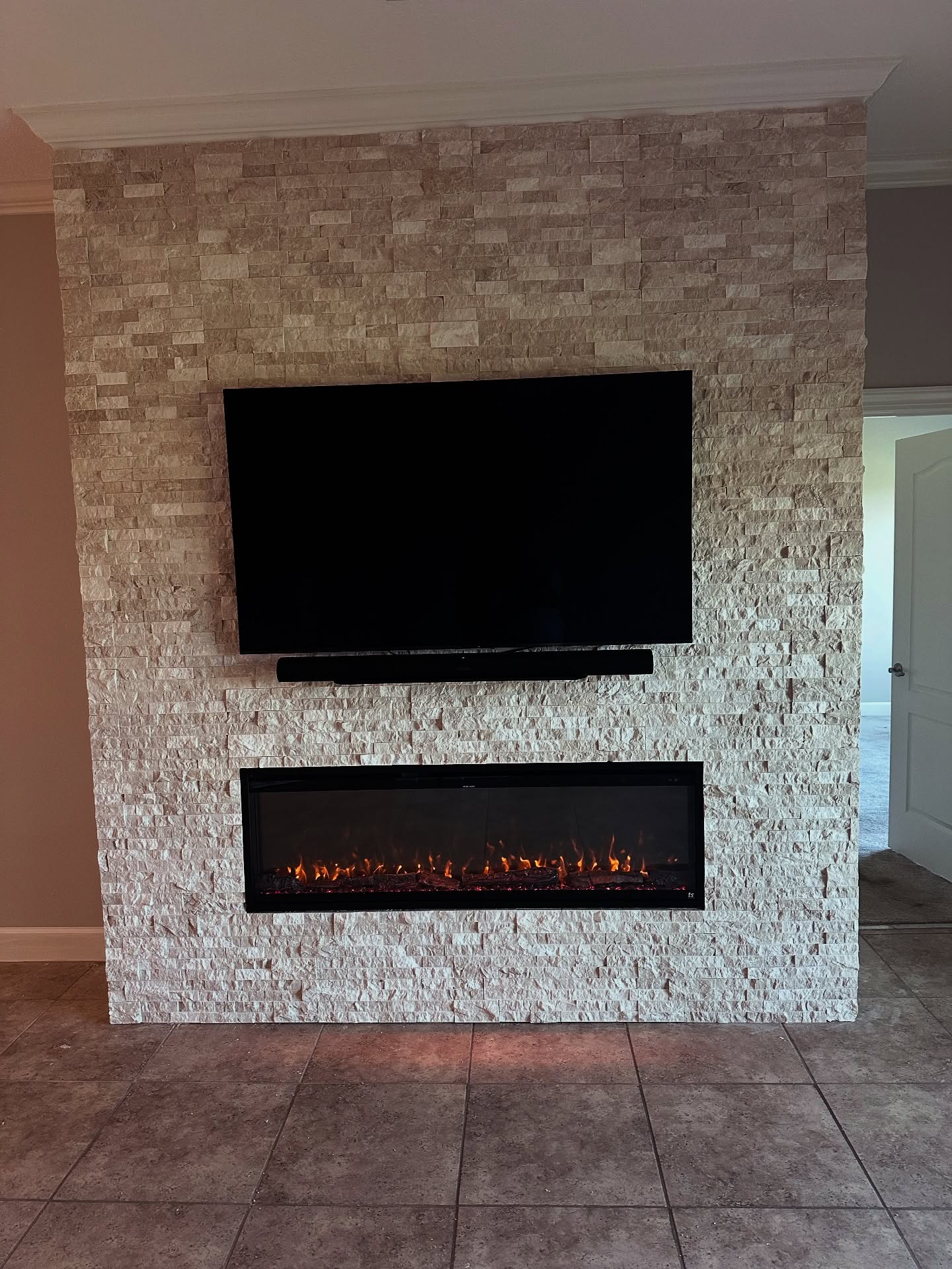 Slat-wall TV feature with hidden wiring by AVP Construction JAX — Jacksonville & St. John's County, FL