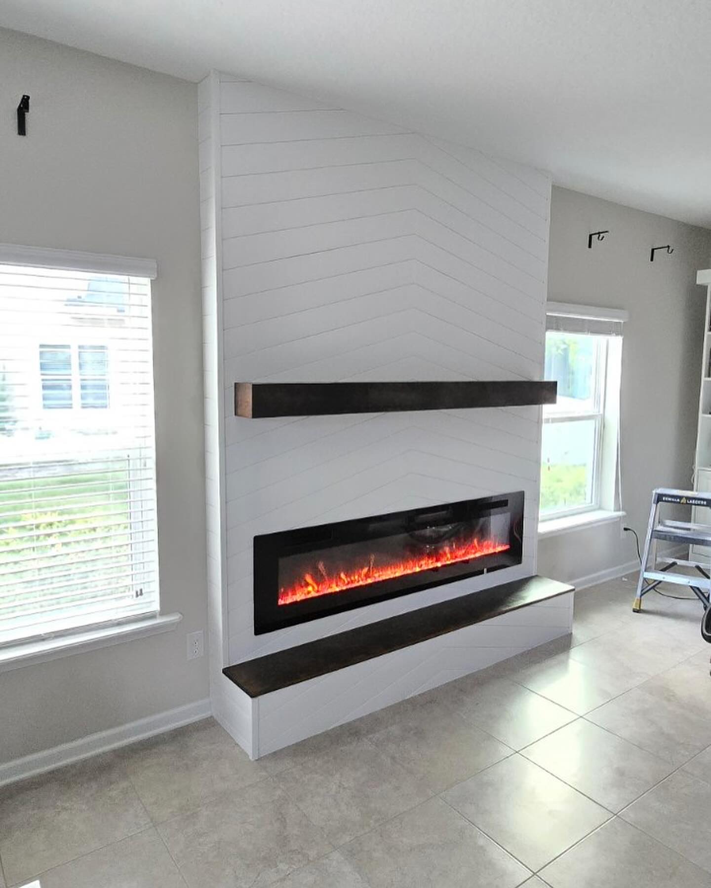 Floating-shelf TV built-in with shaker cabinets by AVP Construction JAX — Jacksonville & St. John's County, FL