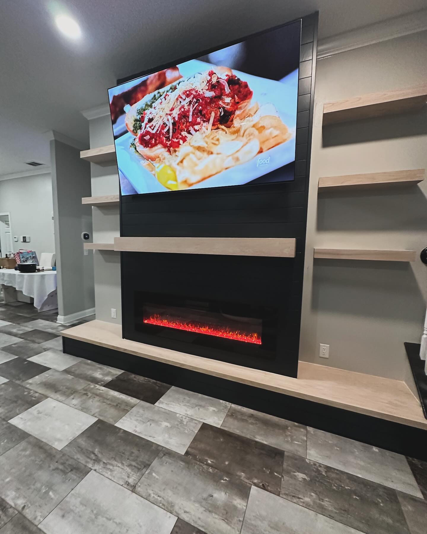 Built-in TV cabinet flanked by display shelving by AVP Construction JAX — Jacksonville & St. John's County, FL