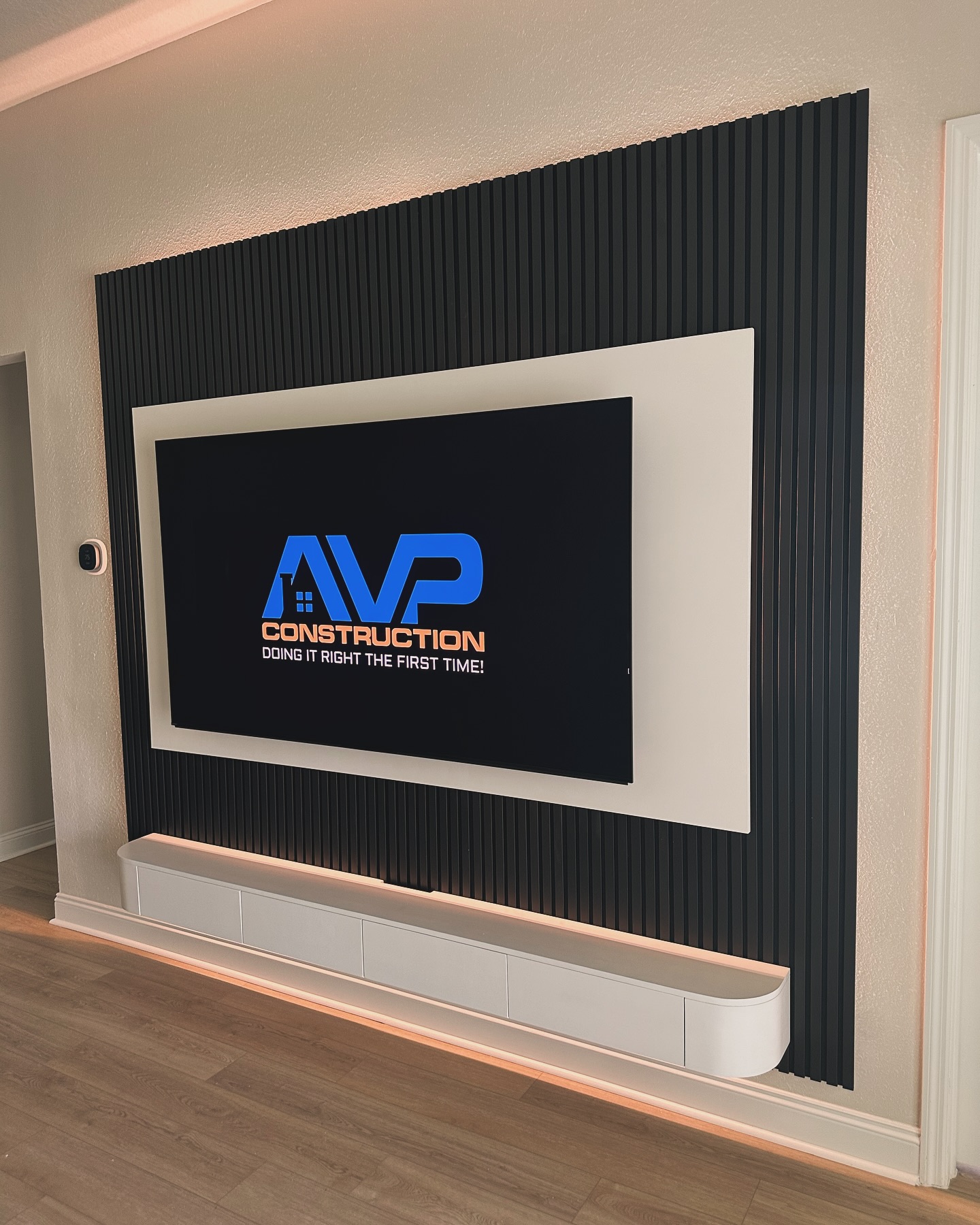 Slat-wall TV feature with hidden wiring by AVP Construction JAX — Jacksonville & St. John's County, FL