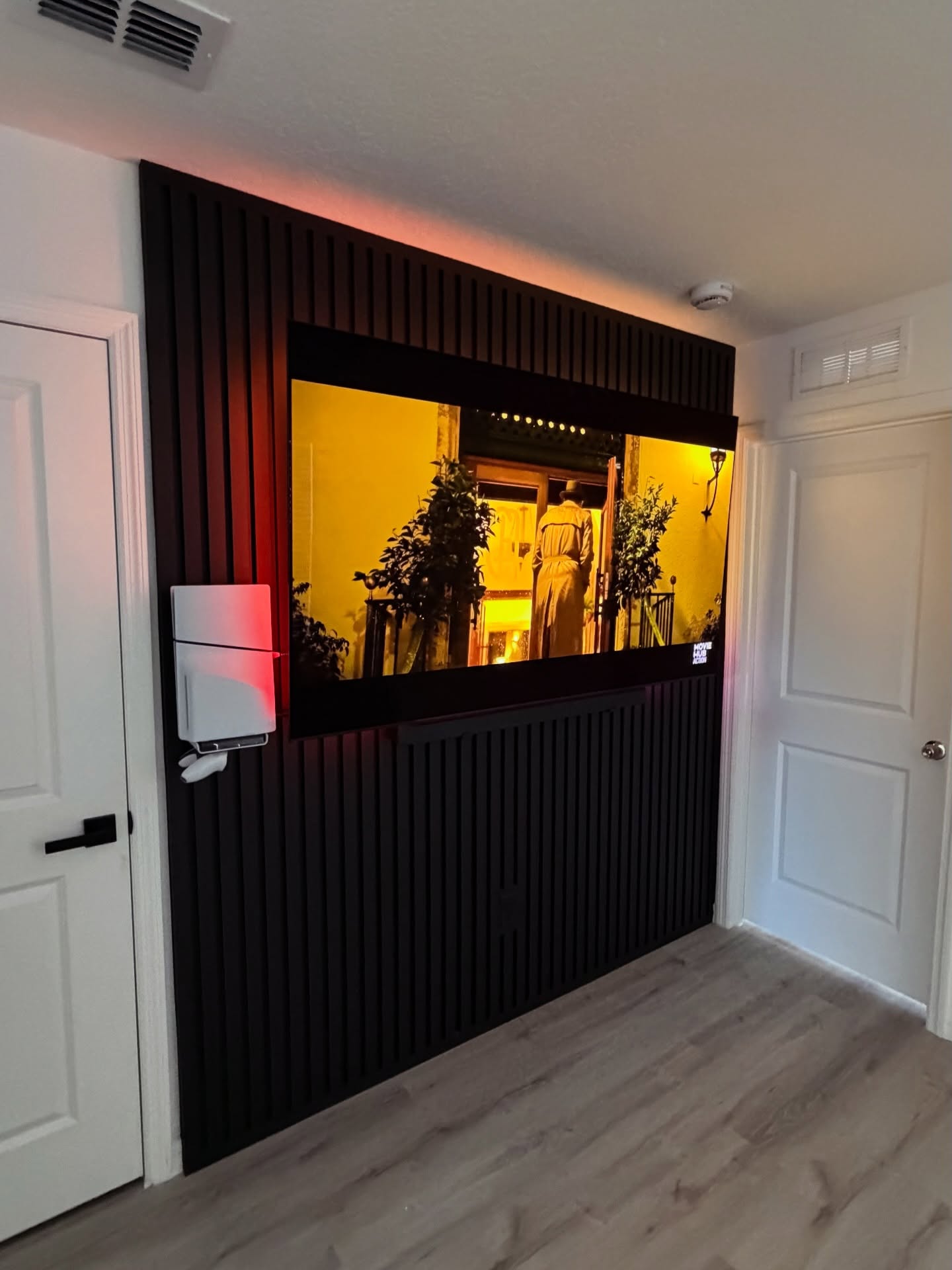 Custom living-room media wall with paneling by AVP Construction JAX — Jacksonville & St. John's County, FL