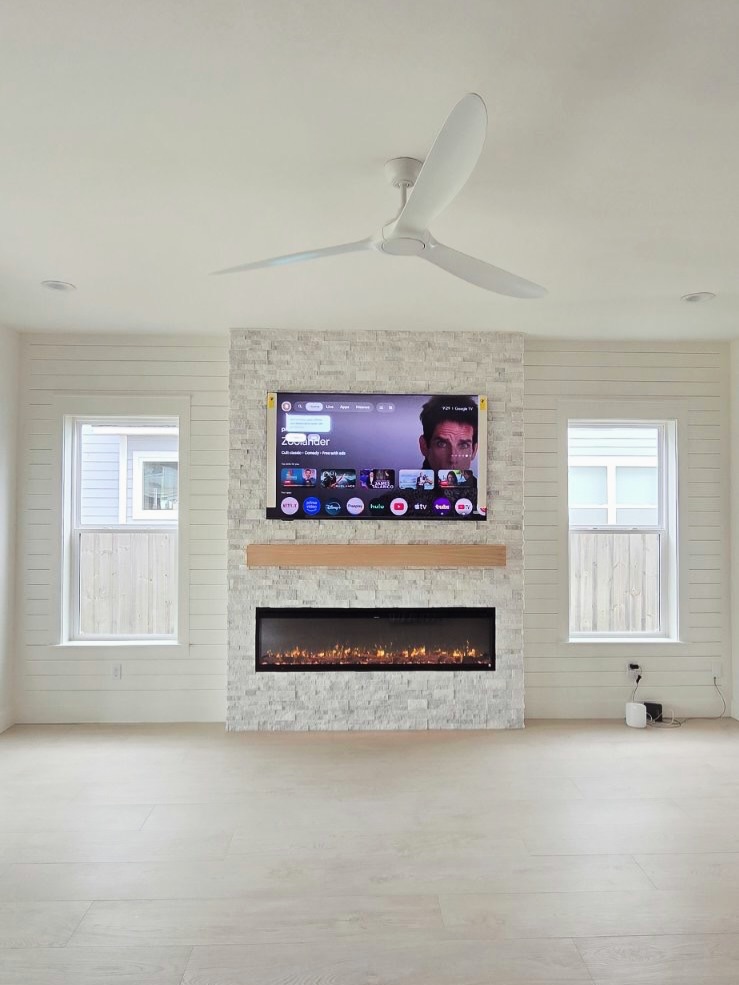 Floor-to-ceiling media wall with custom millwork by AVP Construction JAX — Jacksonville & St. John's County, FL