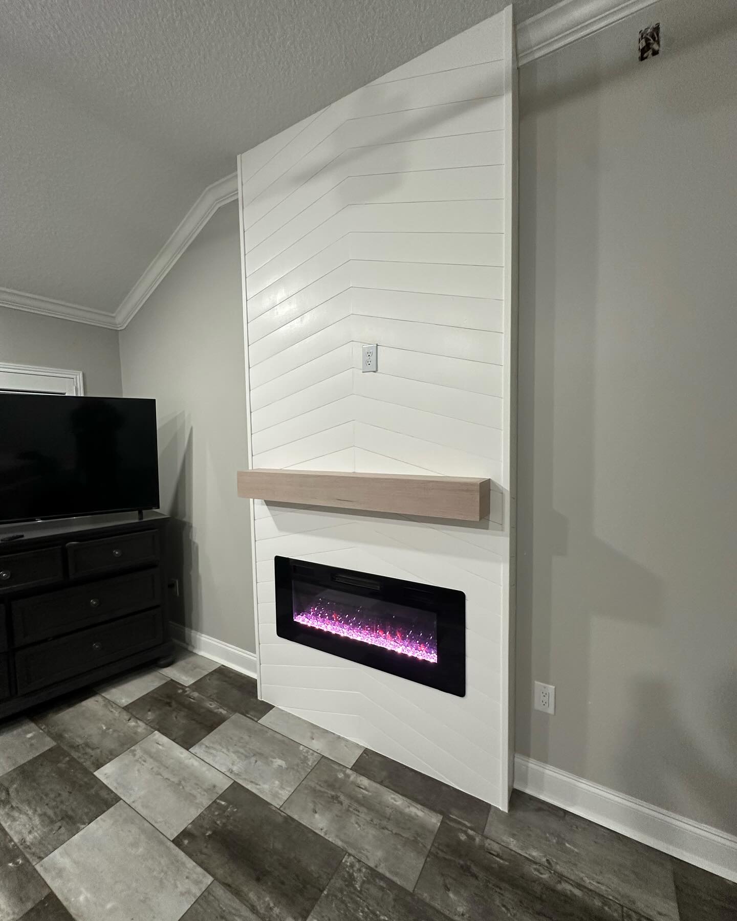 Built-in TV cabinet flanked by display shelving by AVP Construction JAX — Jacksonville & St. John's County, FL