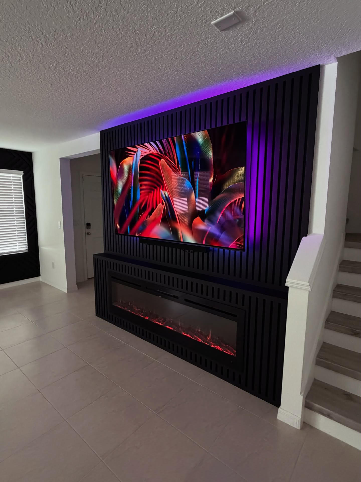 Floor-to-ceiling media wall with custom millwork by AVP Construction JAX — Jacksonville & St. John's County, FL