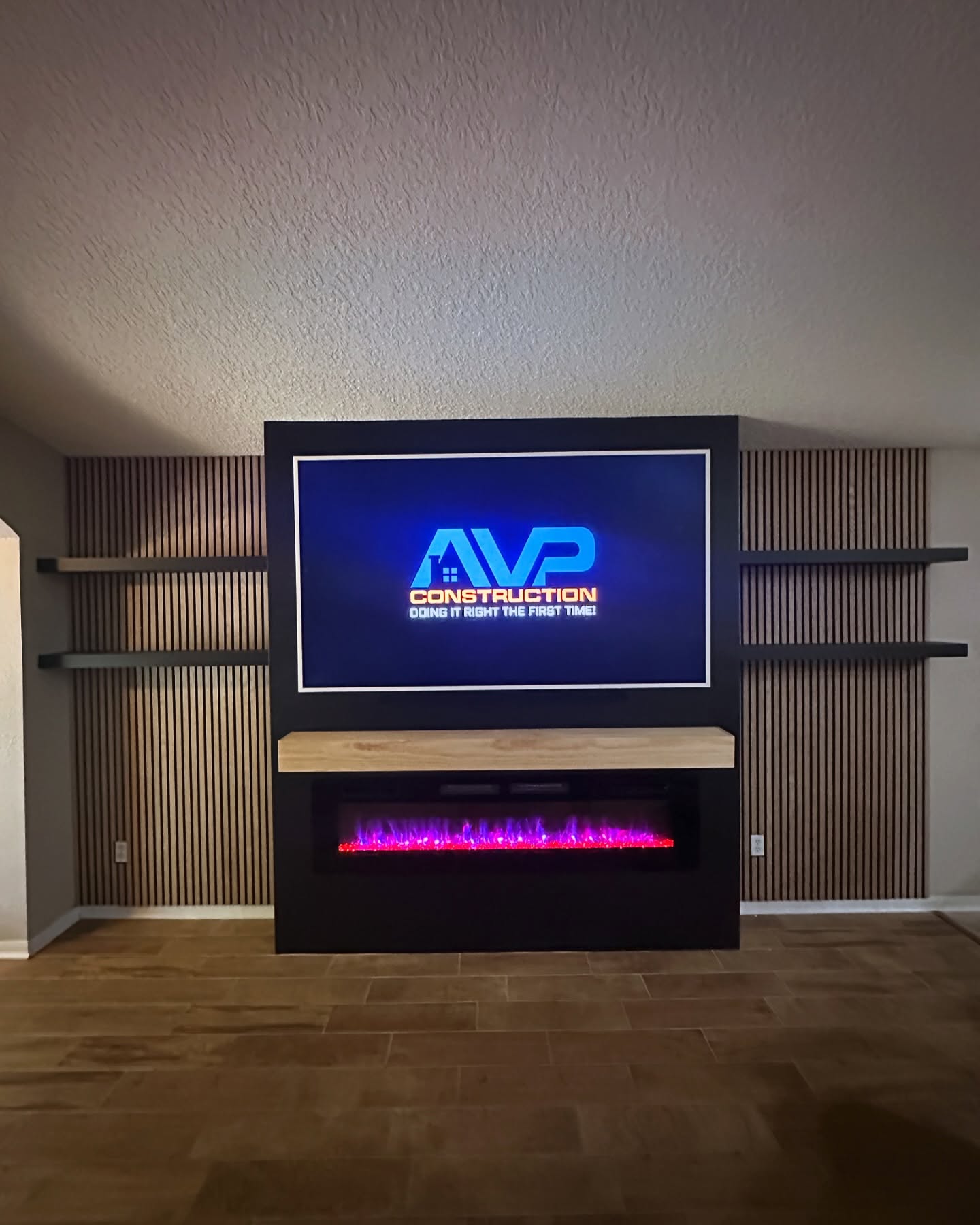 Floating-shelf TV built-in with shaker cabinets by AVP Construction JAX — Jacksonville & St. John's County, FL