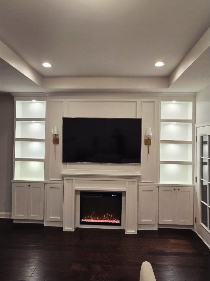 Modern entertainment center with electric fireplace by AVP Construction JAX — Jacksonville & St. John's County, FL