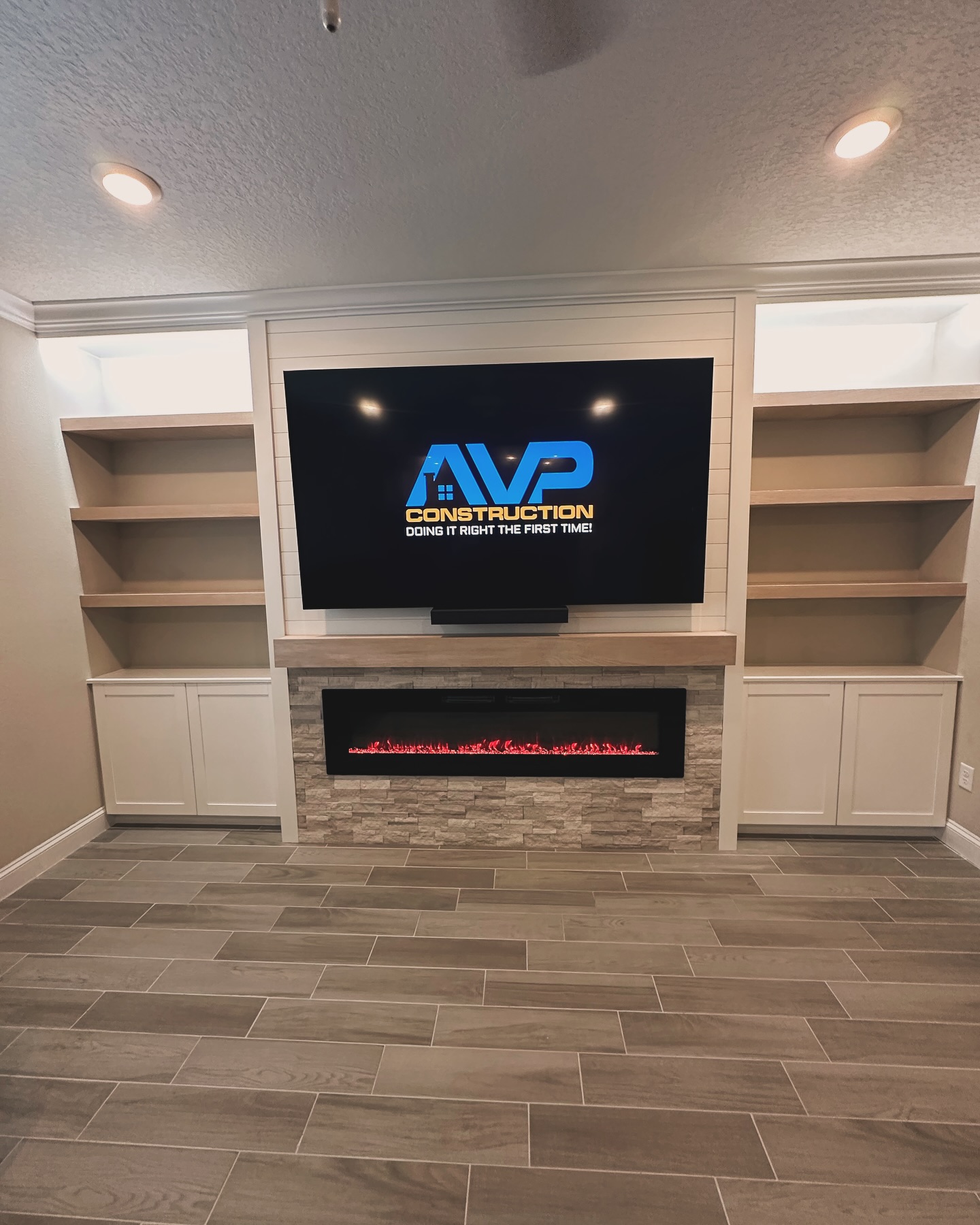 Floor-to-ceiling media wall with custom millwork by AVP Construction JAX — Jacksonville & St. John's County, FL