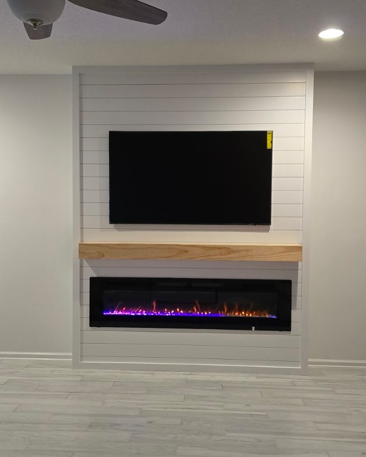 Floating-shelf TV built-in with shaker cabinets by AVP Construction JAX — Jacksonville & St. John's County, FL