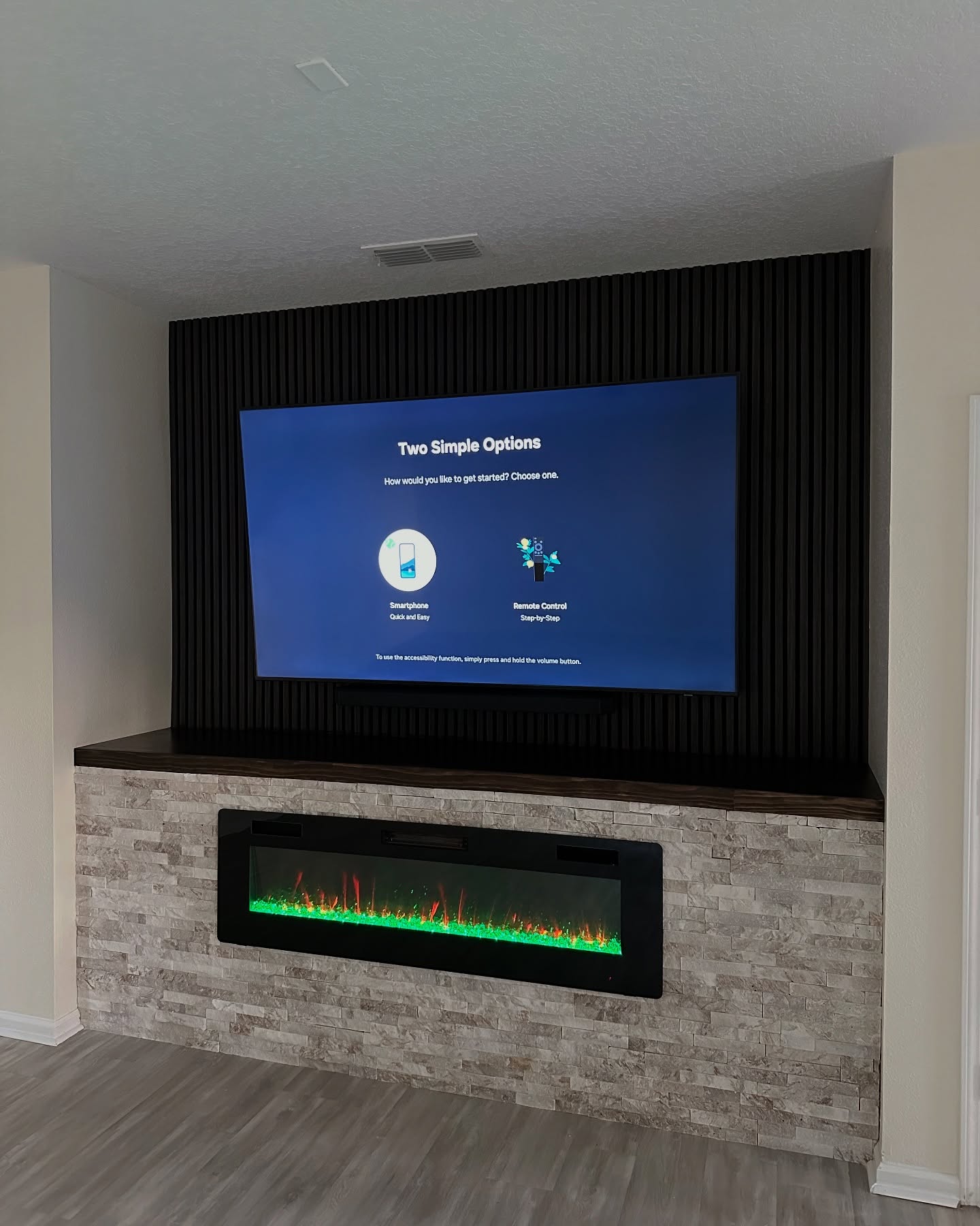 Wall-mounted TV with under-cabinet storage by AVP Construction JAX — Jacksonville & St. John's County, FL
