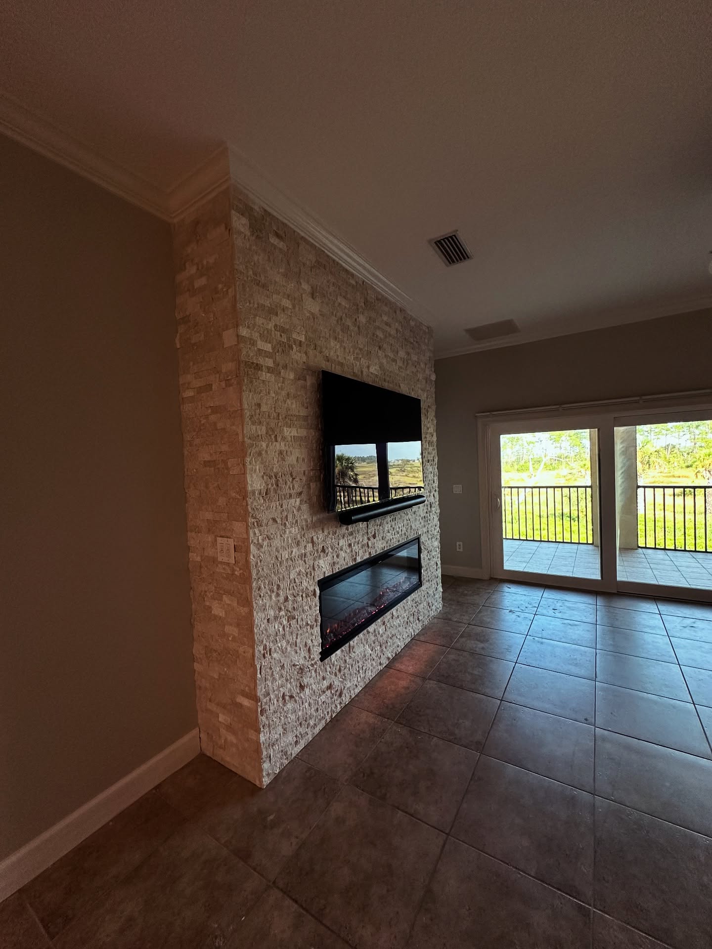 Custom living-room media wall with paneling by AVP Construction JAX — Jacksonville & St. John's County, FL