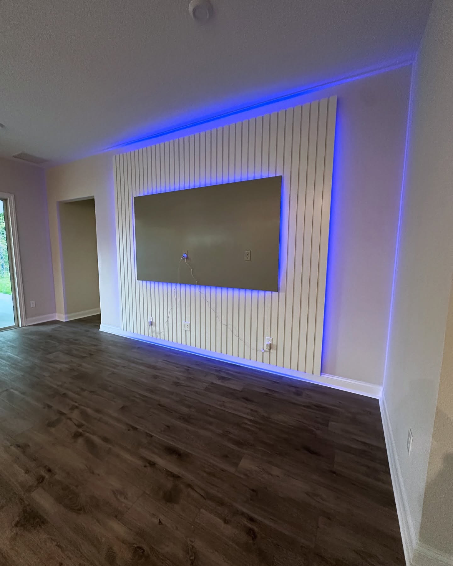 Floating-shelf TV built-in with shaker cabinets by AVP Construction JAX — Jacksonville & St. John's County, FL